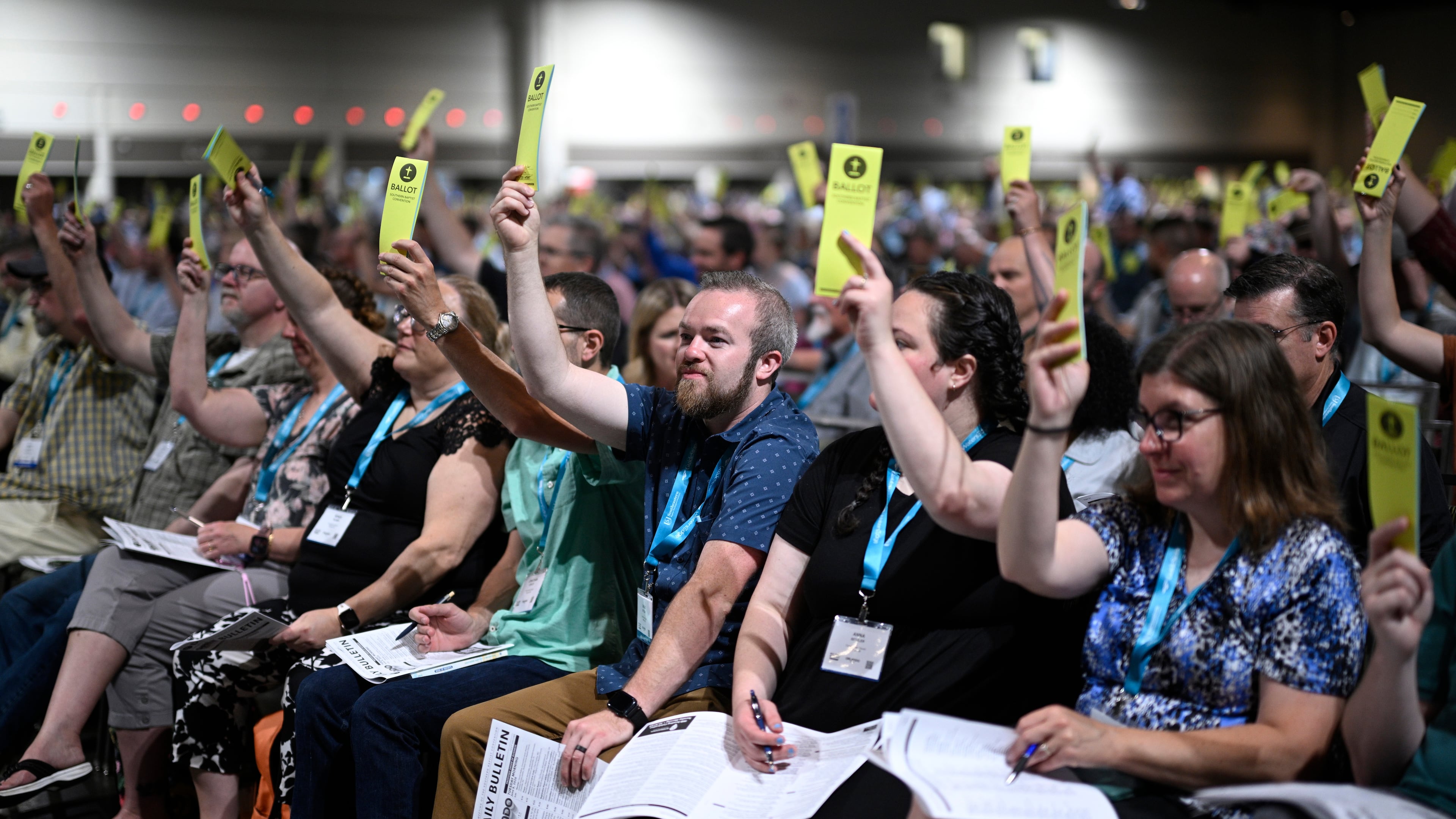 Attendees hold up their ballots while voting on a motion during the annual meeting of the Southern Baptist Convention, Tuesday, June 9, 2026, in Orlando, Fla. (AP Photo/Phelan M. Ebenhack)
