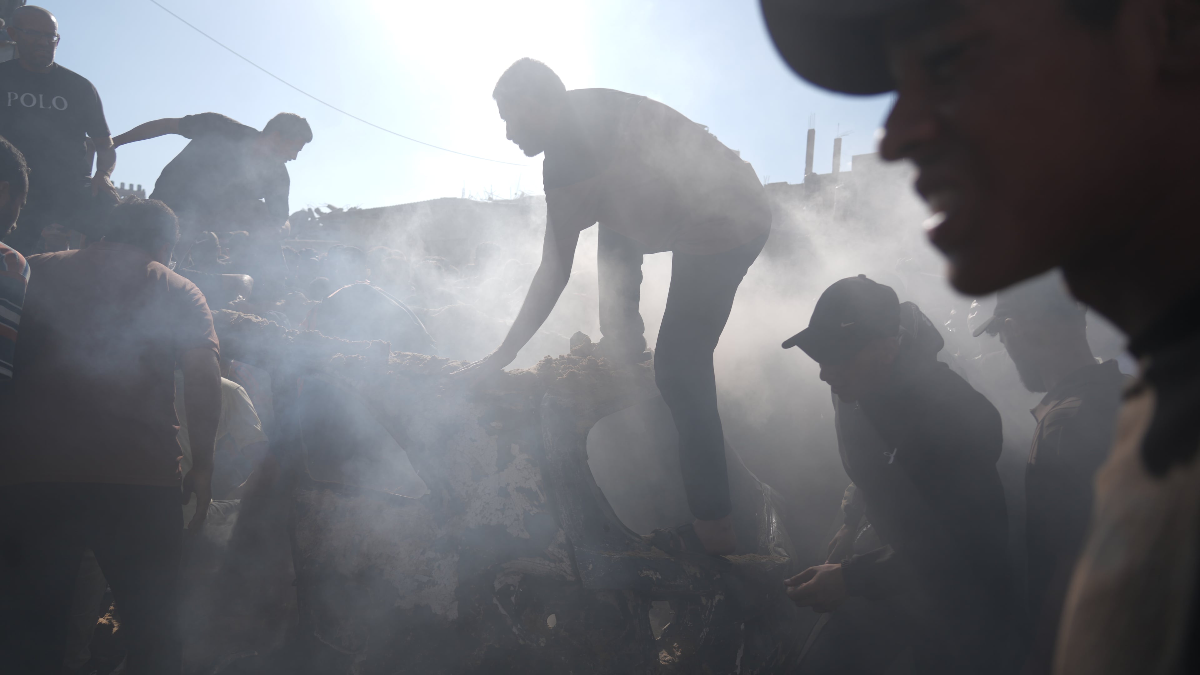 People operate on a destroyed vehicle following an Israeli airstrike in Gaza city, Saturday, Sept. 19, 2026. (AP Photo/Jehad Alshrafi)