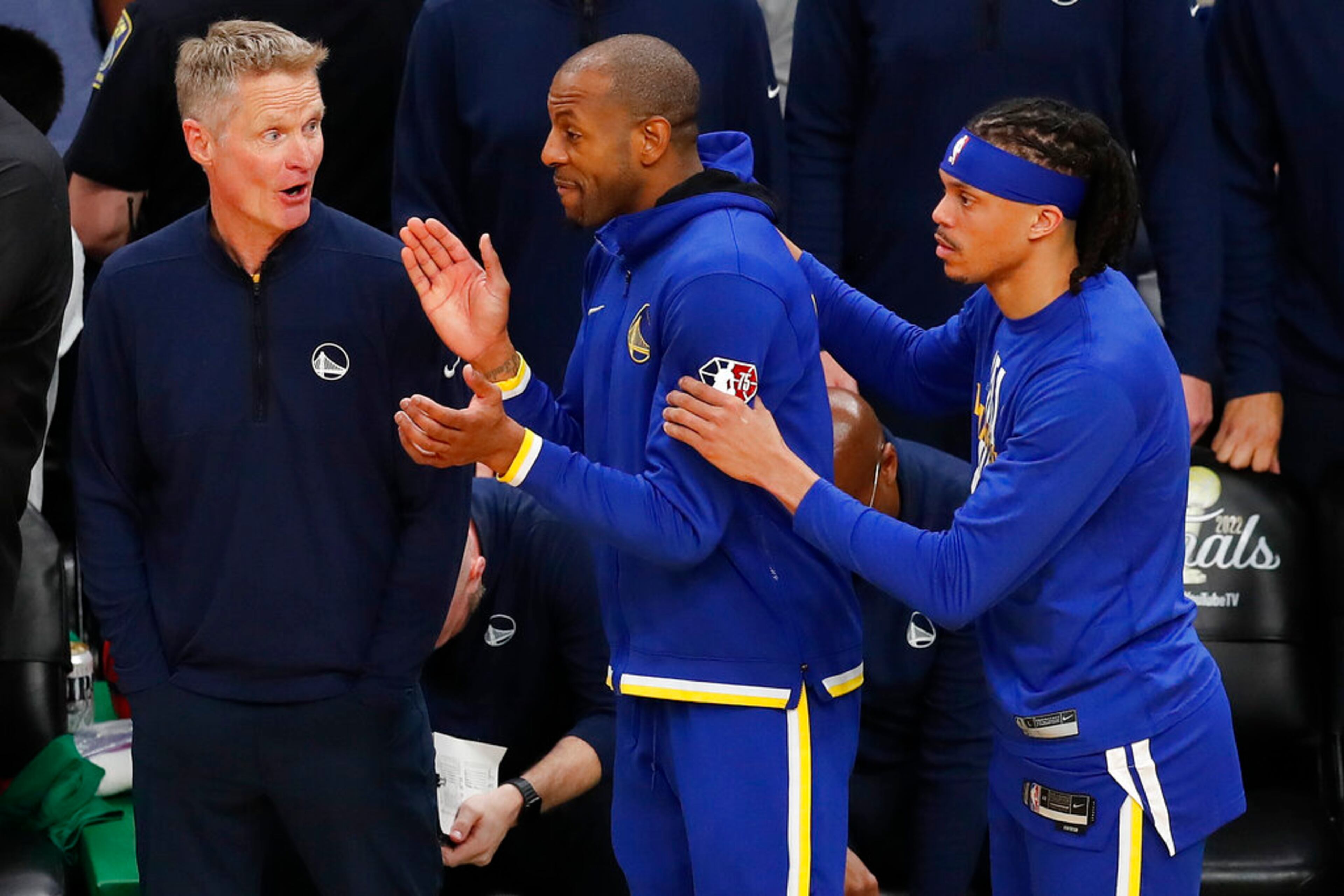 Golden State Warriors head coach Steve Kerr, left, talks with players during the fourth quarter of Game 6 of basketball's NBA Finals against the Boston Celtics, Thursday, June 16, 2022, in Boston. (AP Photo/Michael Dwyer)