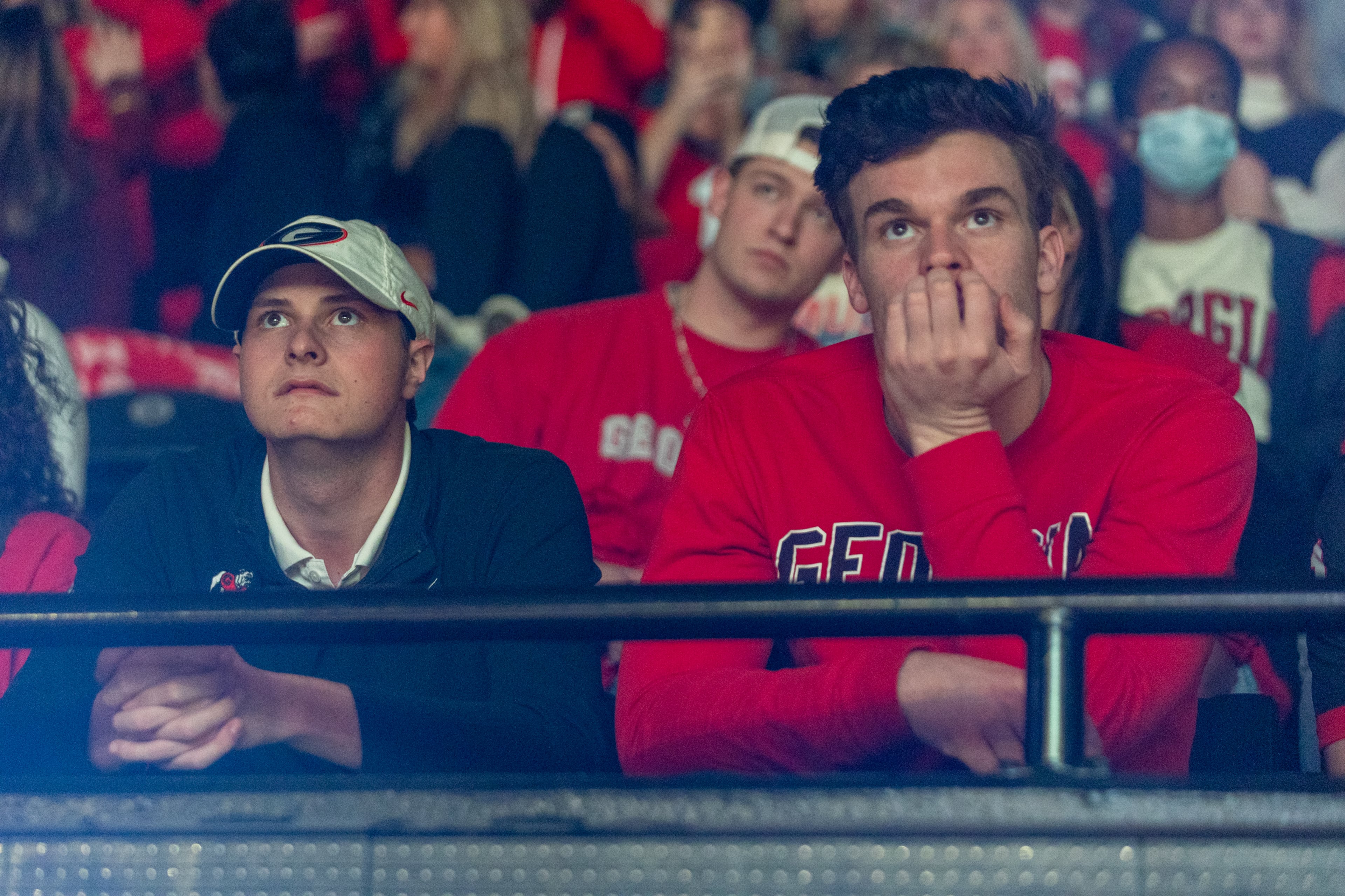 Georgia Bulldogs fans react to pregame programming during the College Football Playoff national championship game at a watch party at Stegeman Coliseum on the University of Georgia campus on Monday, January 10, 2022. (Photo: Nathan Posner for The Atlanta Journal-Constitution)