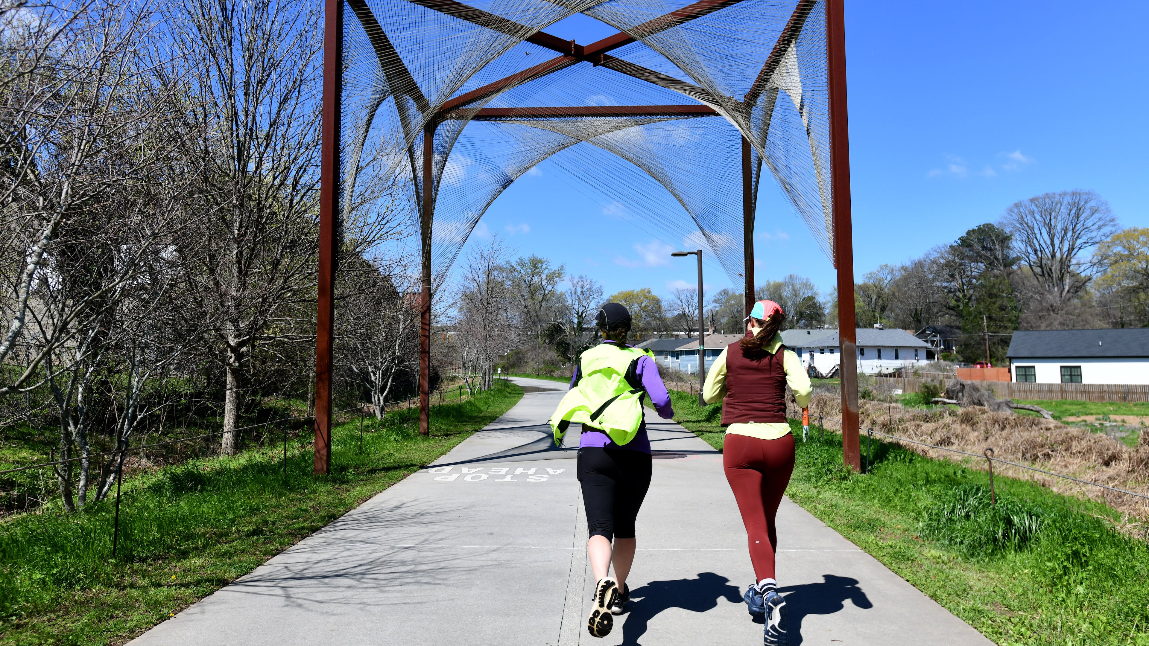 Joggers exercise on Atlanta Beltline Southwest Trail, Thursday, March 12, 2026, in Atlanta. The Atlanta Beltline announced that it has a new designation: home of the world's longest linear arboretum, spanning more than 12 miles of completed trail. (Hyosub Shin/AJC)