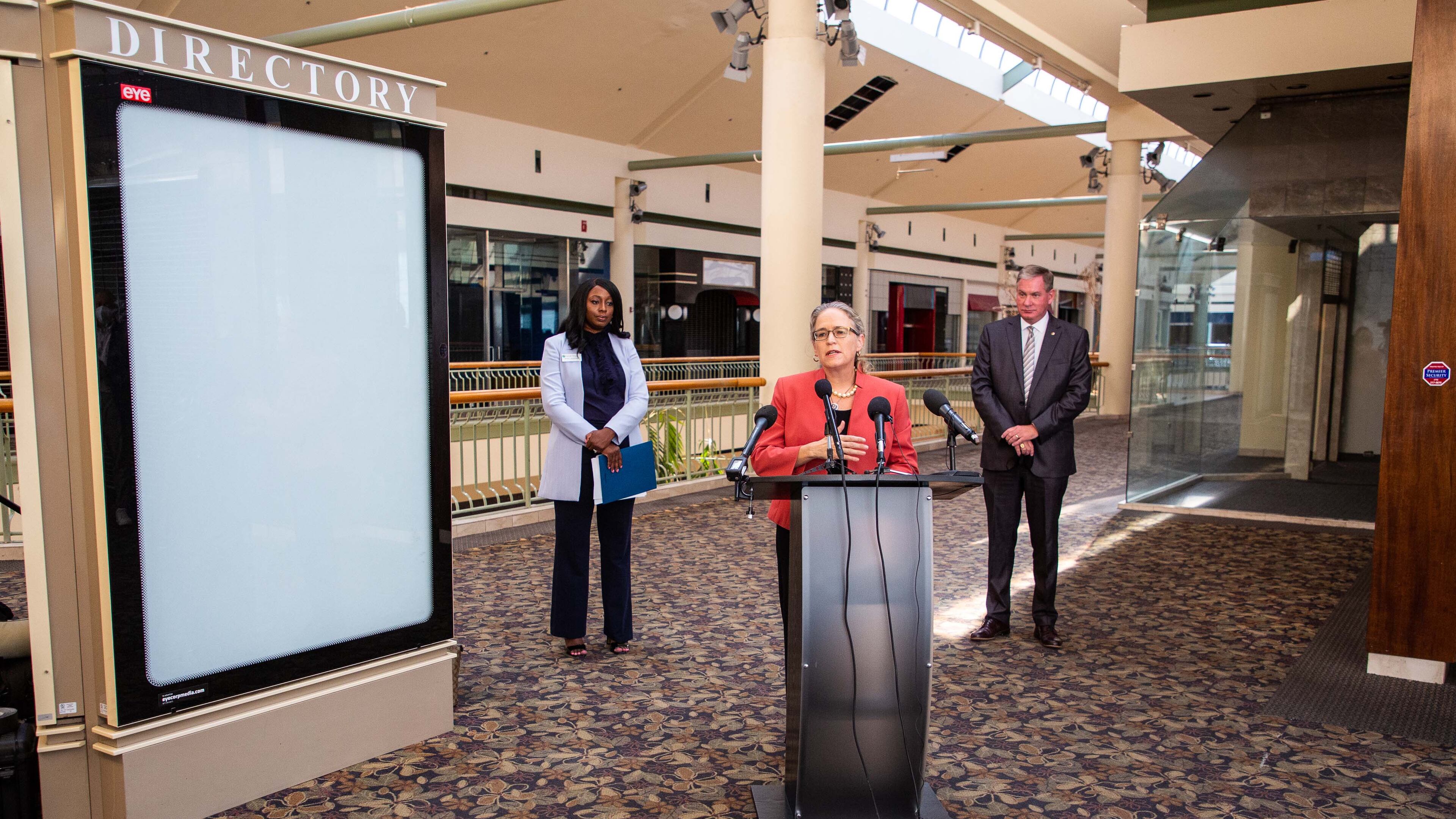 U.S. Rep. Carolyn Bourdeaux talks during a press conference flanked by Gwinnett County Commission Chairwoman Nicole Love Hendrickson (L) and Gwinnett Place Community Improvement District Director Joe Allen (R) at the mostly vacant Gwinnett Place Mall in Duluth. STEVE SCHAEFER FOR THE ATLANTA JOURNAL-CONSTITUTION