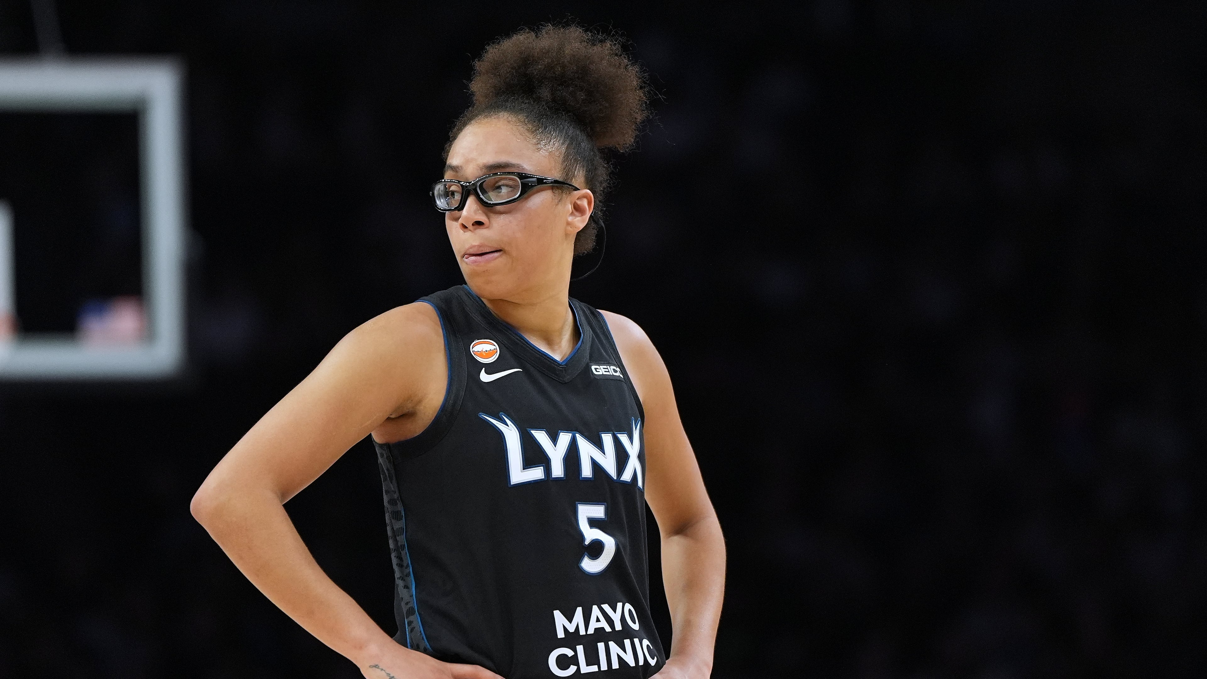 Minnesota Lynx guard Olivia Miles stands on the court during the second half of a WNBA basketball game against the New York Liberty, Friday, Sept. 18, 2026, in Minneapolis. (AP Photo/Abbie Parr)