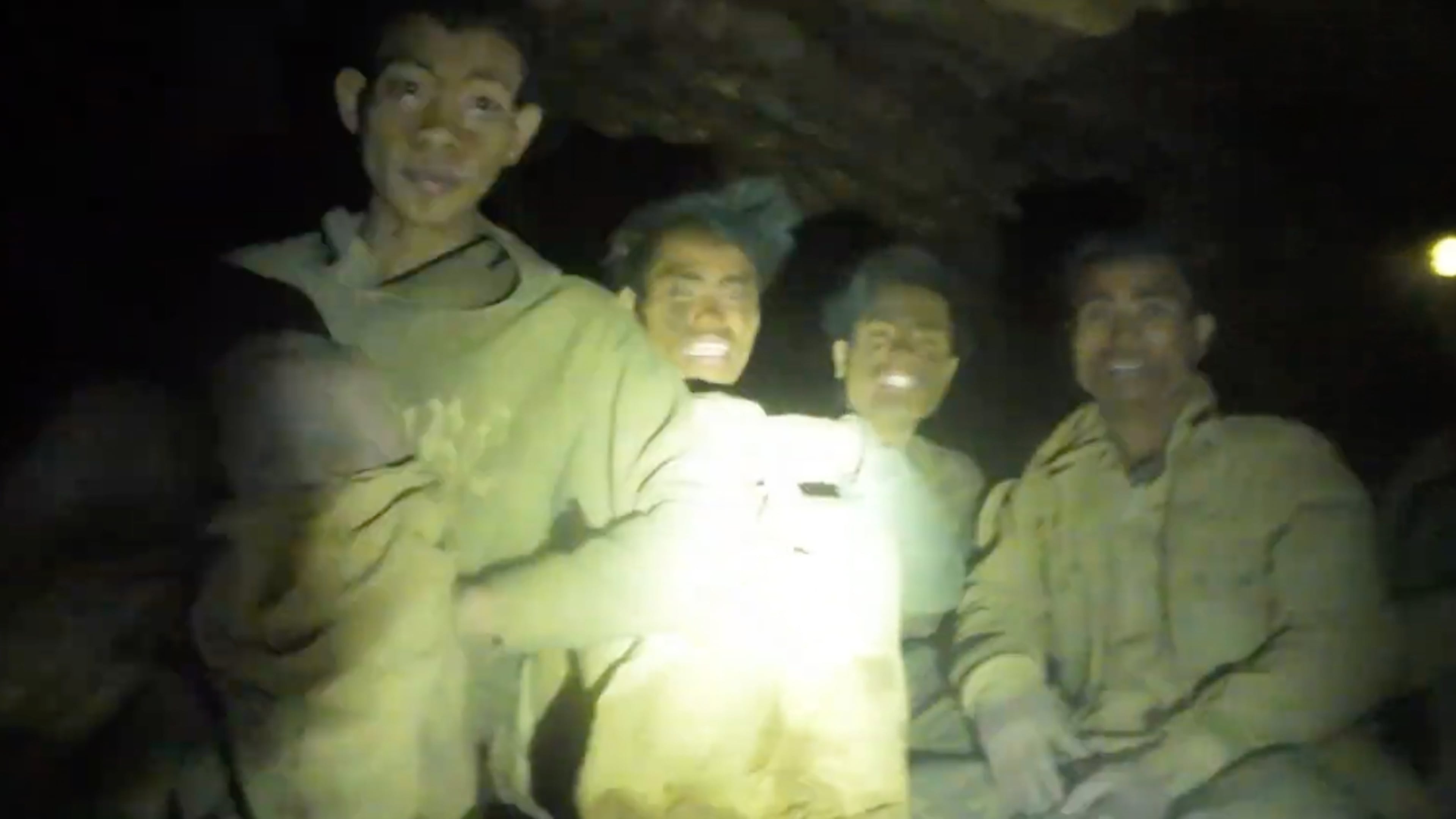 This image made from the video provided by Benz Norrased Palasing Seascout Diving shows the villagers who were trapped and found in a flooded cave in Xaisomboun province, Laos, Wednesday, May 27, 2026. (Benz Norrased Palasing Seascout Diving via AP)
