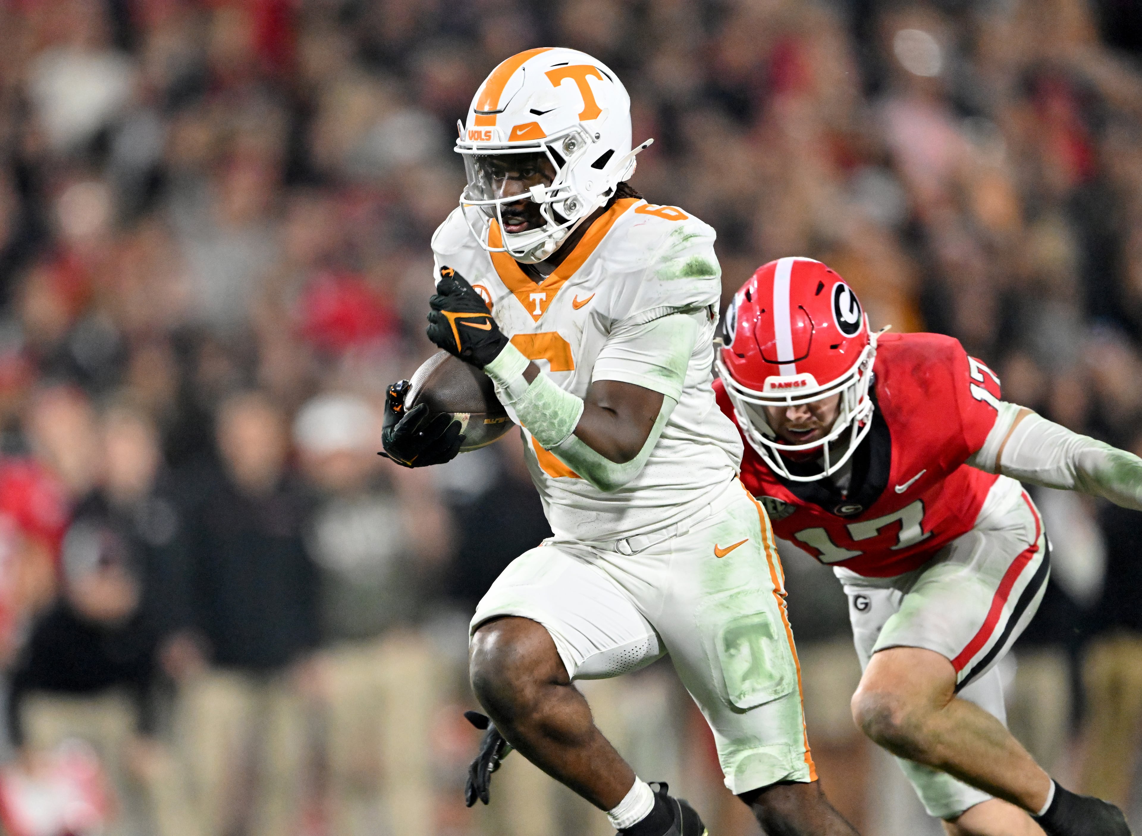 Tennessee running back Dylan Sampson (6) runs for a touchdown past Georgia defensive back Dan Jackson (17) during the first half in an NCAA football game at Sanford Stadium, Saturday, November 16, 2024, in Athens. (Hyosub Shin / AJC)
