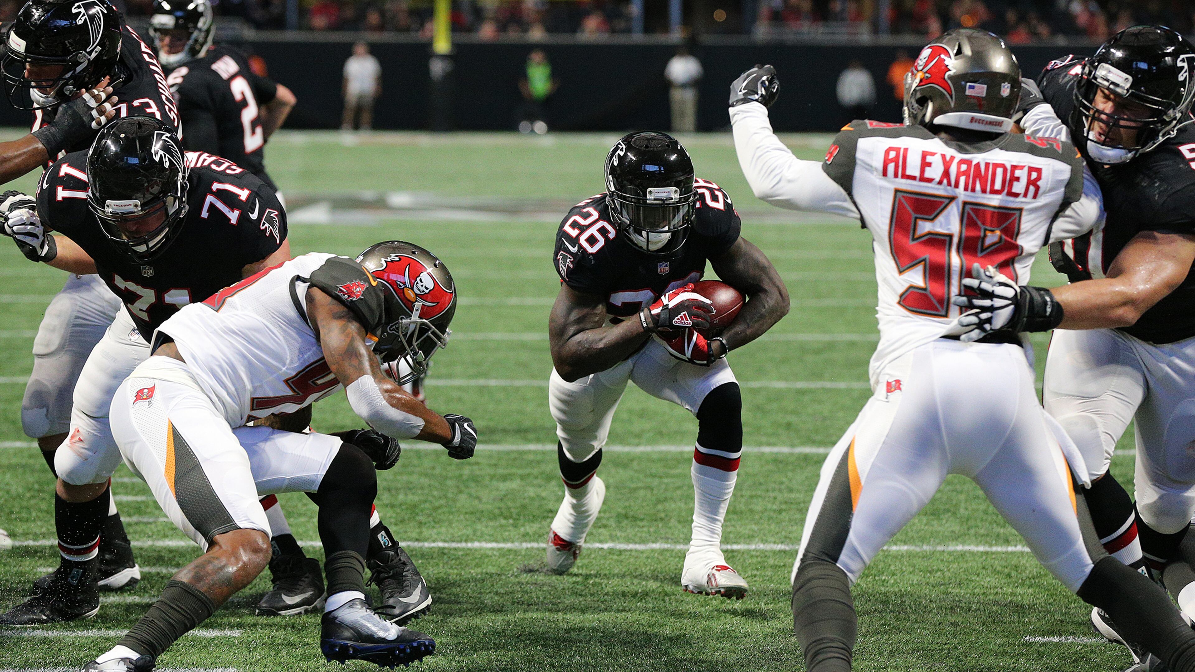 November 26, 2017 Atlanta: Falcons running back Tevin Coleman rushes for his first of two second half touchdowns to take a 27-6 lead over the Buccaneers during the third quarter in a NFL football game on Sunday, November 26, 2017, in Atlanta. Curtis Compton/ccompton@ajc.com