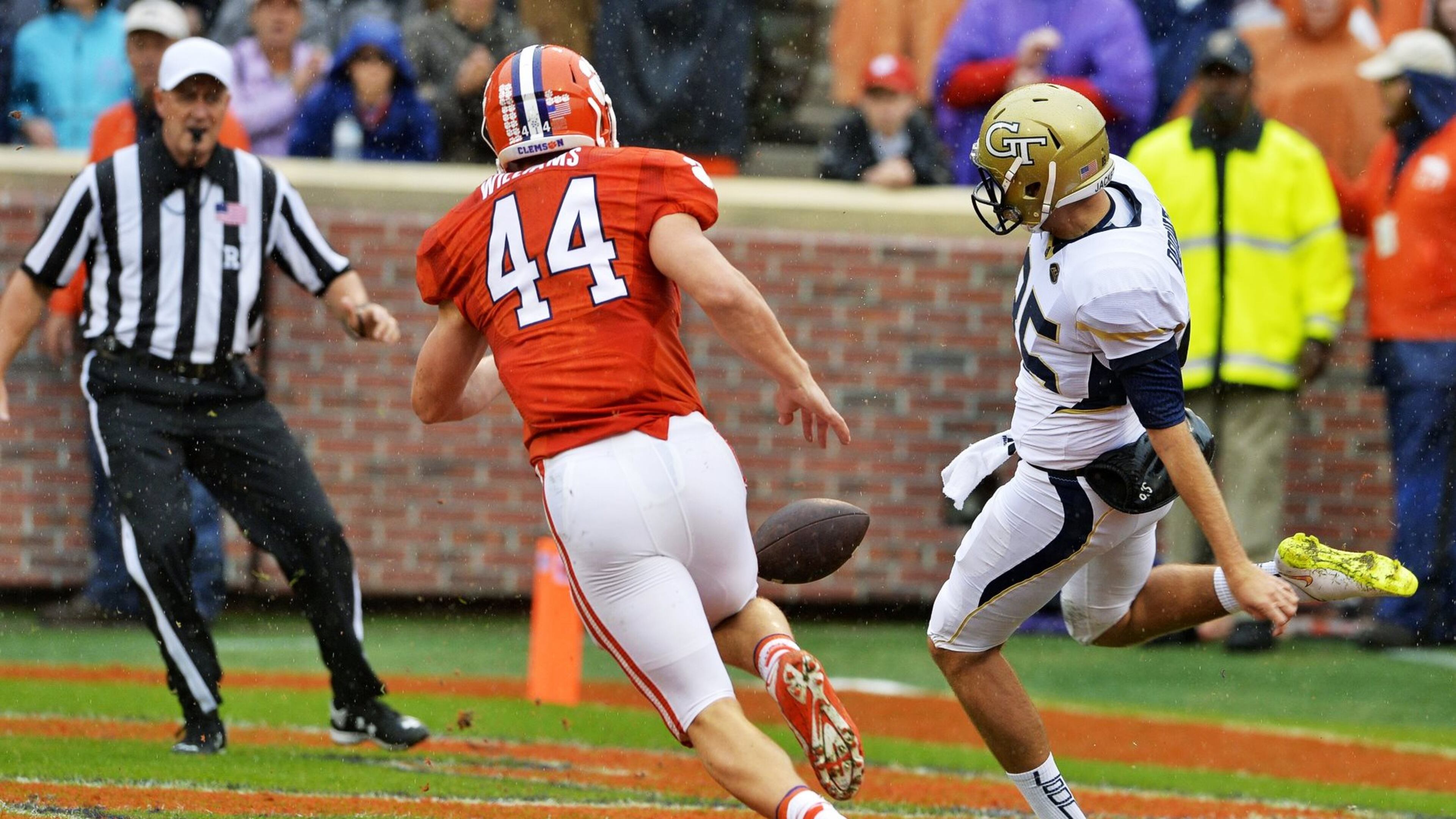 Georgia Tech punter Ryan Rodwell kicks a punt under pressure from a Clemson player. The snap sailed over Rodwell’s head, the third time in three games that Tech’s special teams made a mistake on the snap. (AP Richard Shiro)