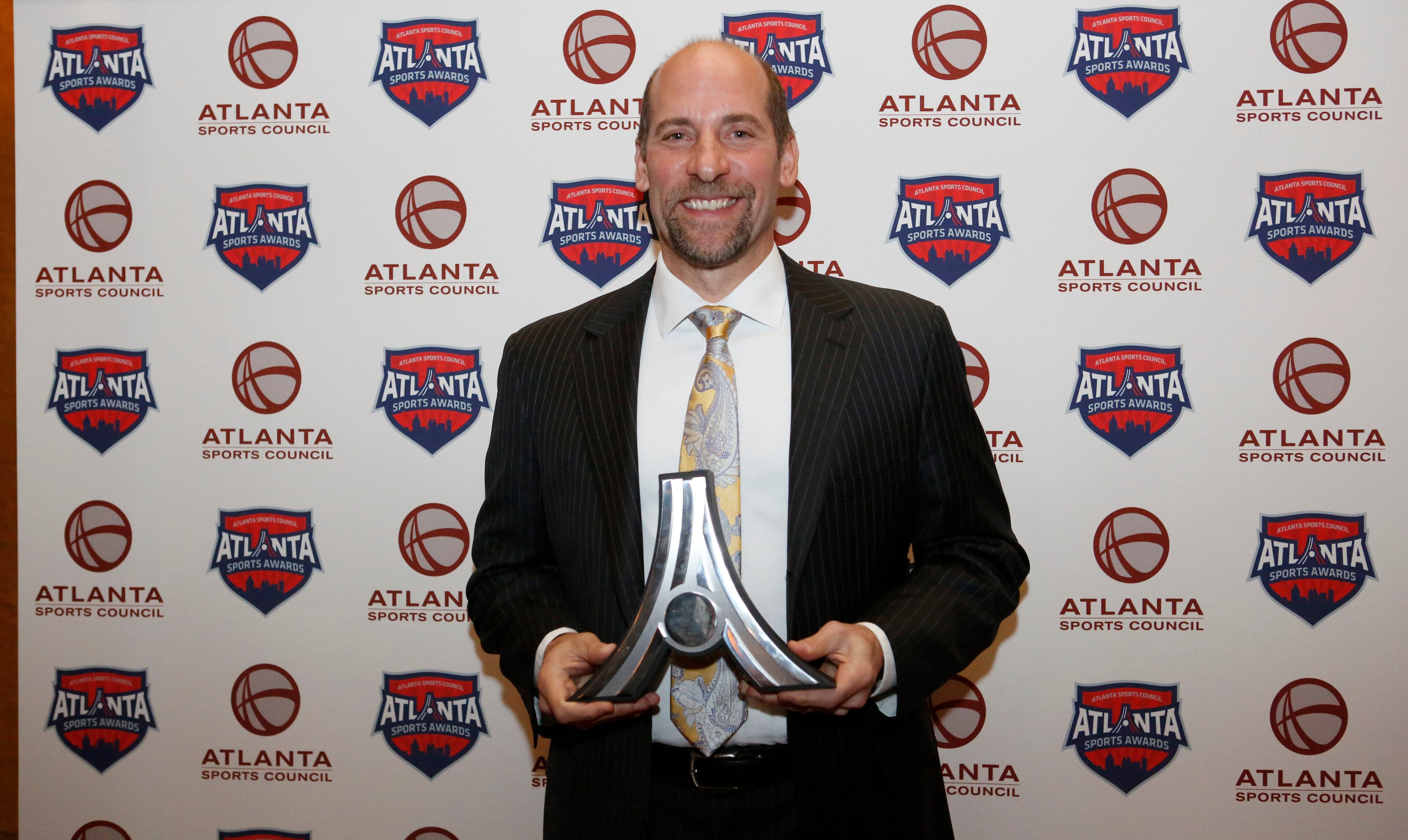 Former Atlanta Braves pitcher John Smoltz poses for a photo with the 2016 Lifetime Achievement Award during the Atlanta Sports Awards at the Fox Theatre Thursday, February 25, 2016, in Atlanta. PHOTO / JASON GETZ