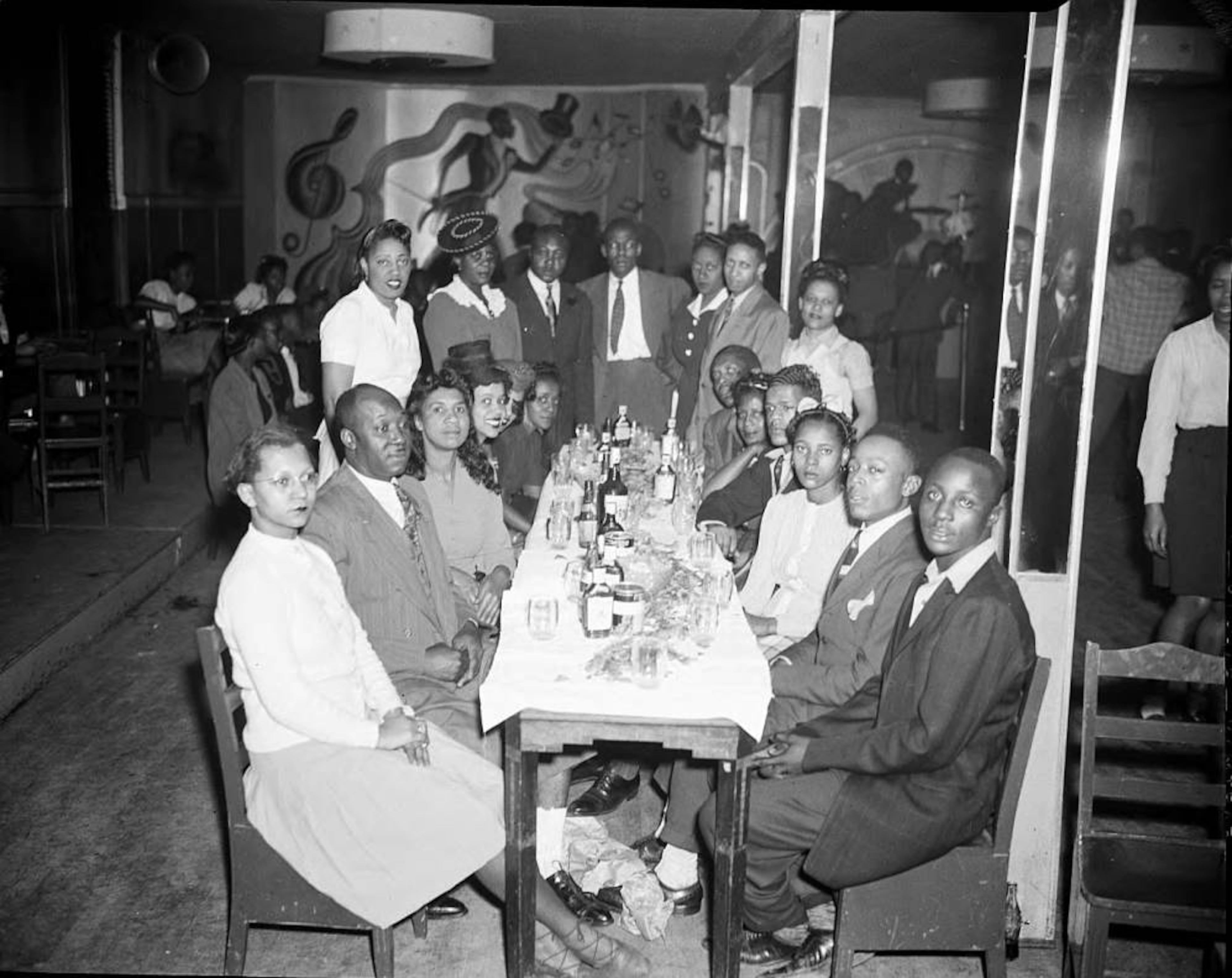 "High Hat" dance and party on Auburn Avenue in Atlanta, January 21, 1943. Photo shoot commissioned by fashion and home-goods mail-order merchandiser, Chicago Mail Order Company, owned by Alden's. LBCE4-025c, Lane Brothers Commercial Photographers Photographic Collection, 1920-1976. Photographic Collection, Special Collections and Archives, Georgia State University Library.