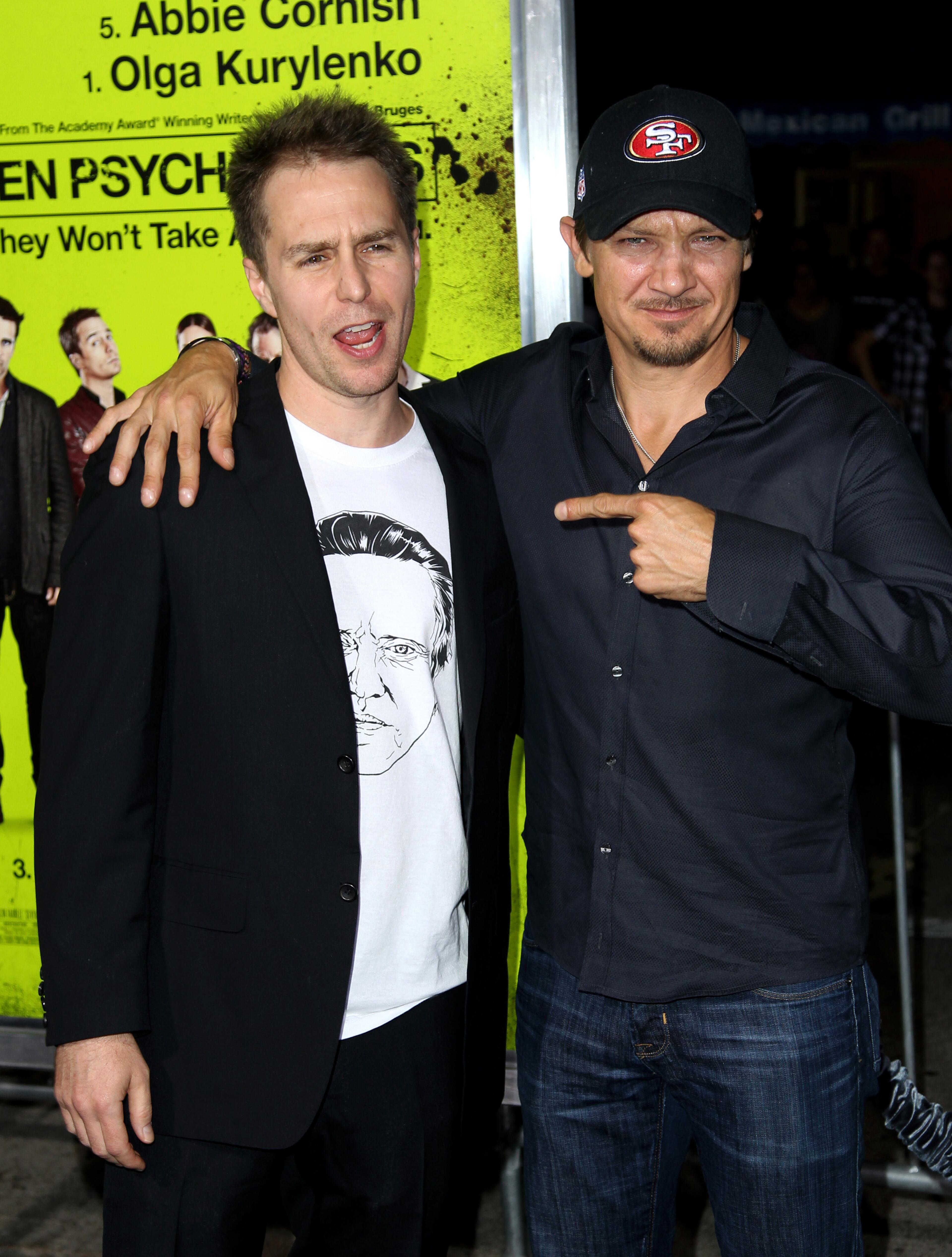 Cast member Sam Rockwell, left, and actor Jeremy Renner pose together at the premiere of "Seven Psychopaths" at the Bruin Theatre on Monday, Oct. 1, 2012, in Los Angeles.