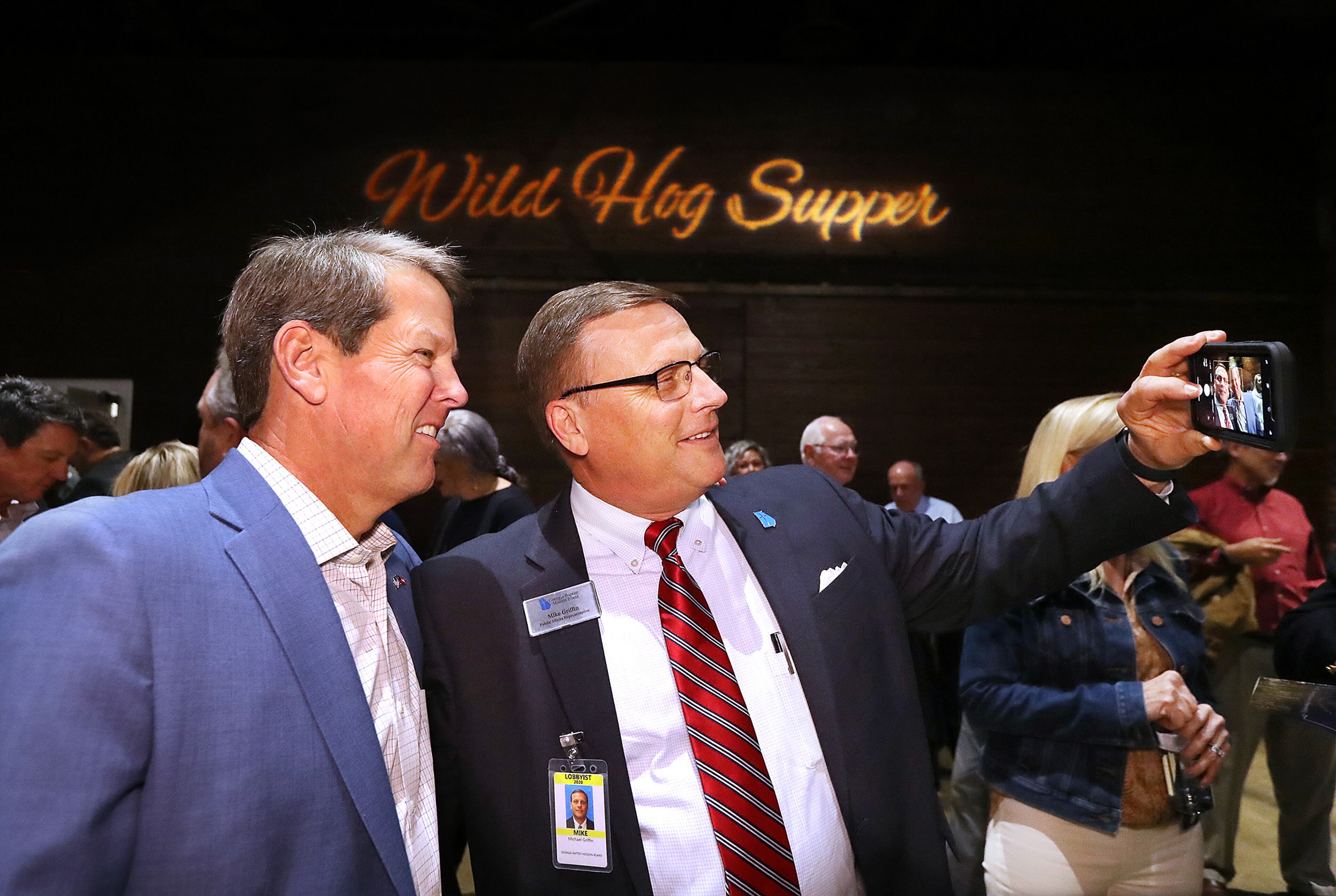 January 12, 2020 Atlanta: Lobbyist Mike Griffin, Georgia Baptist Mission Board, snaps a selfie with Governor Brian Kemp as he arrives for the Wild Hog Supper legislative kickoff event at the Georgia Freight Depot on Sunday, January 12, 2020, in Atlanta. Curtis Compton ccompton@ajc.com