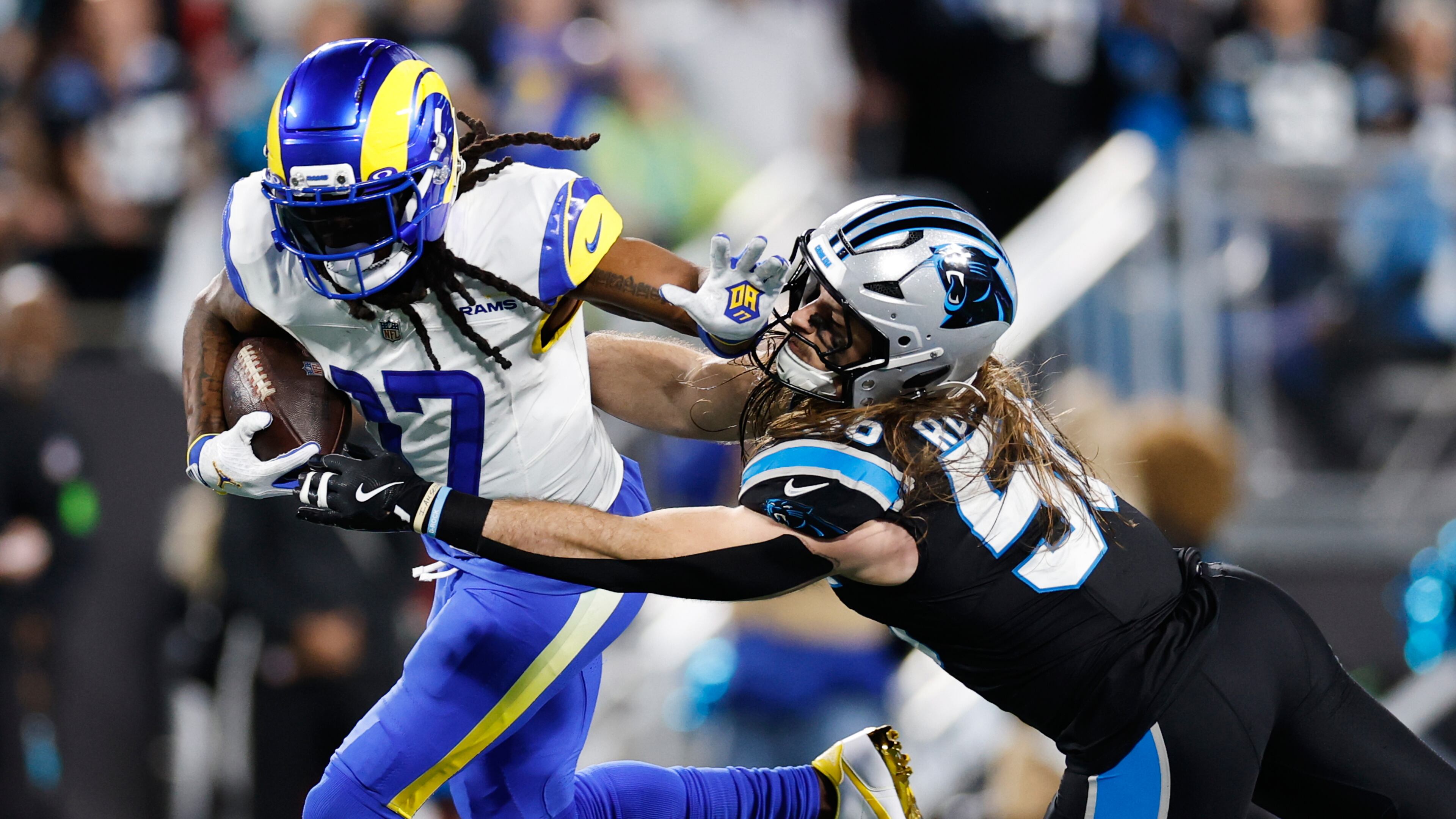 Los Angeles Rams wide receiver Davante Adams (17) is tackled by Carolina Panthers linebacker Christian Rozeboom during the second half of an NFL wild-card playoff football game, Saturday, Jan. 10, 2026, in Charlotte, N.C. (AP Photo/Rusty Jones)