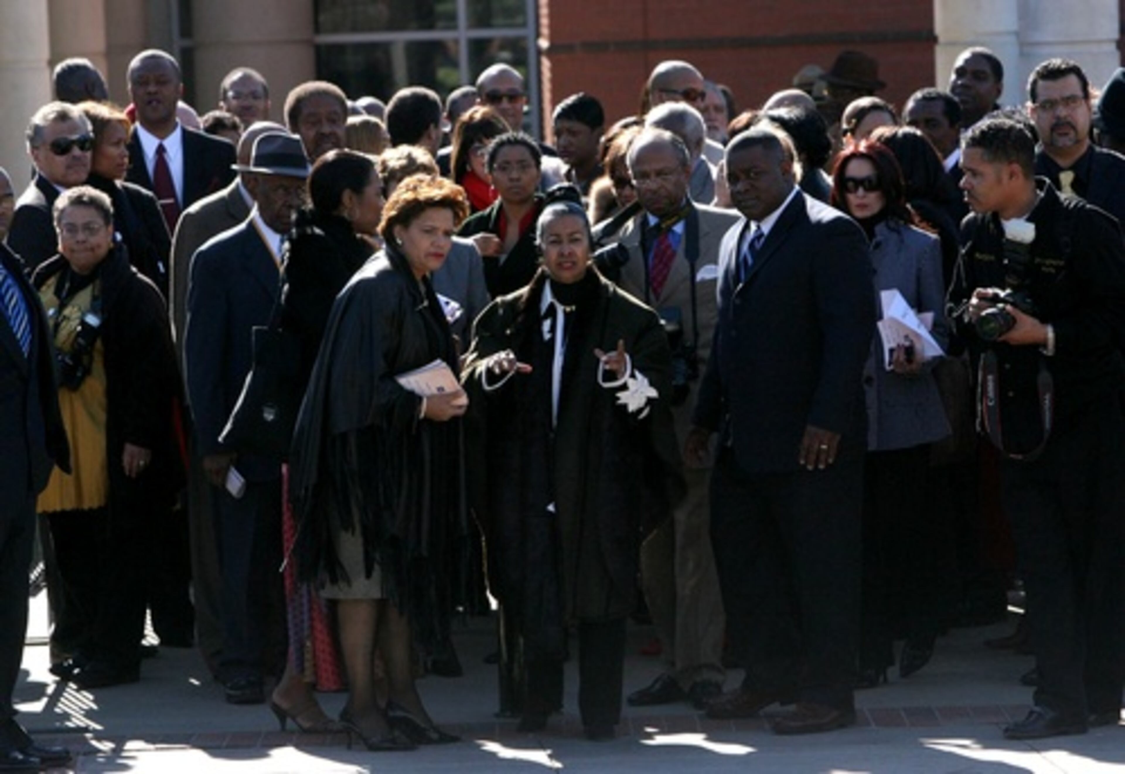 Xernona Clayon (center) , creator of the International Civil Rights Walk of Fame, checks out the site Saturday. She is also president and CEO of the Trumpet Awards Foundation, which presents its awards this weekend.