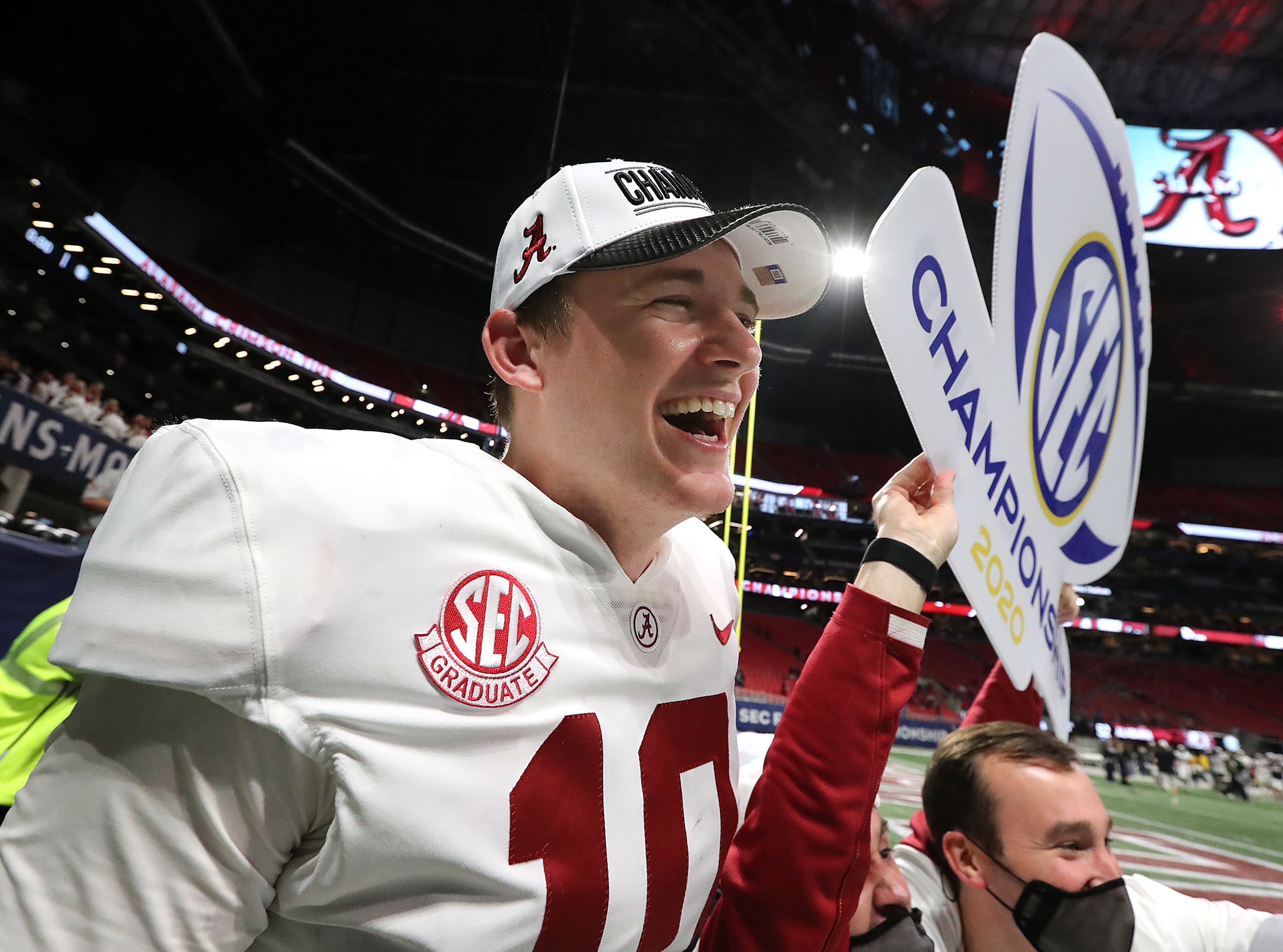 Alabama quarterback Mac Jones (center) celebrates a 52-46 victory over Florida in the SEC Championship NCAA college football game on Saturday, Dec. 19, 2020, in Atlanta. “Curtis Compton / Curtis.Compton@ajc.com”