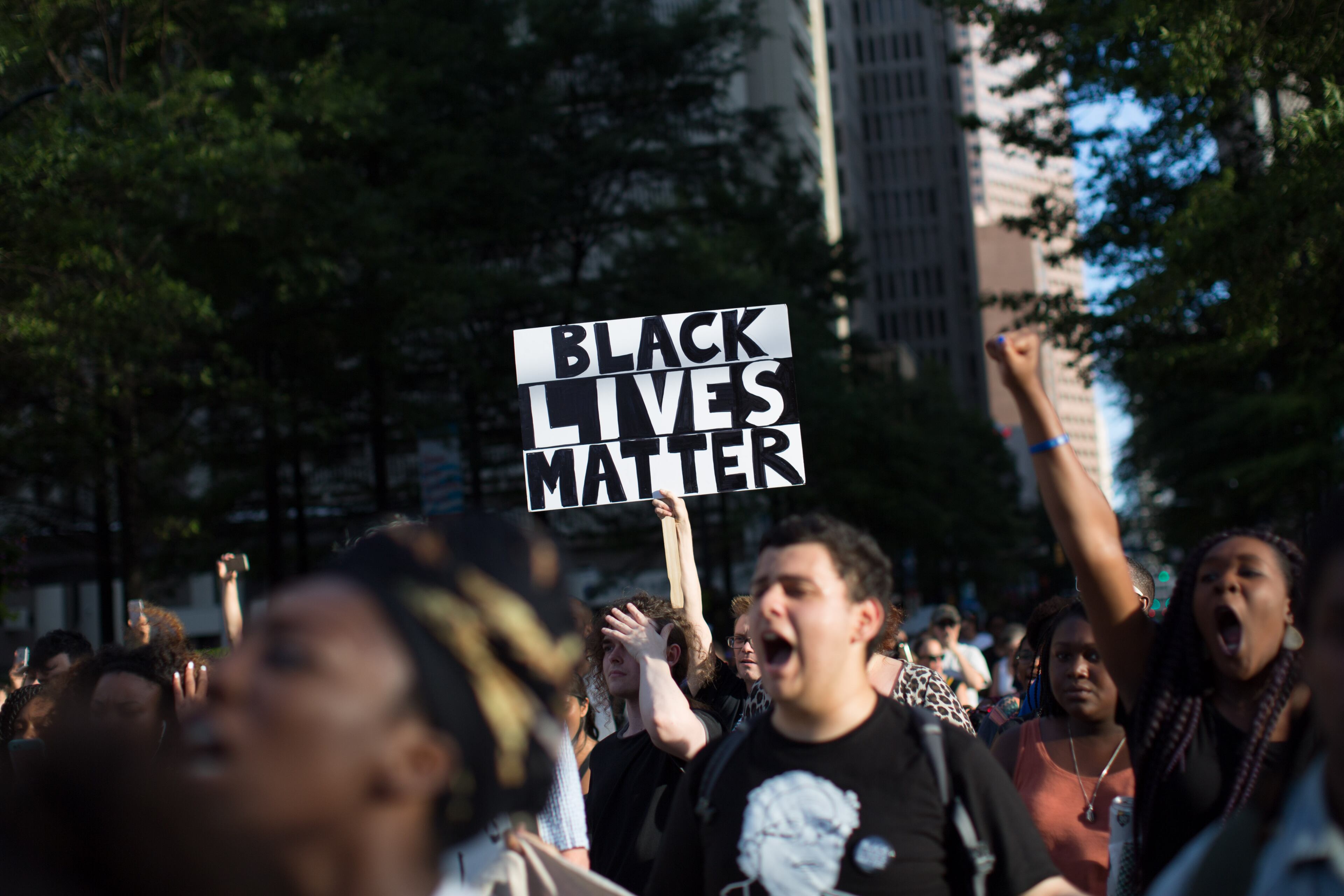 Demonstrators march down Peachtree Street to Piedmont Park, Thursday, July 7, 2016, in Atlanta. Demonstrators gathered in response to the death of 37-year-old Alton Sterling, who was killed by Baton Rouge police outside of a convenience store where he was selling CDs and Philando Castile, who was shot and killed when Minnesota police stopped him for a traffic violation on Wednesday evening. BRANDEN CAMP/SPECIAL
