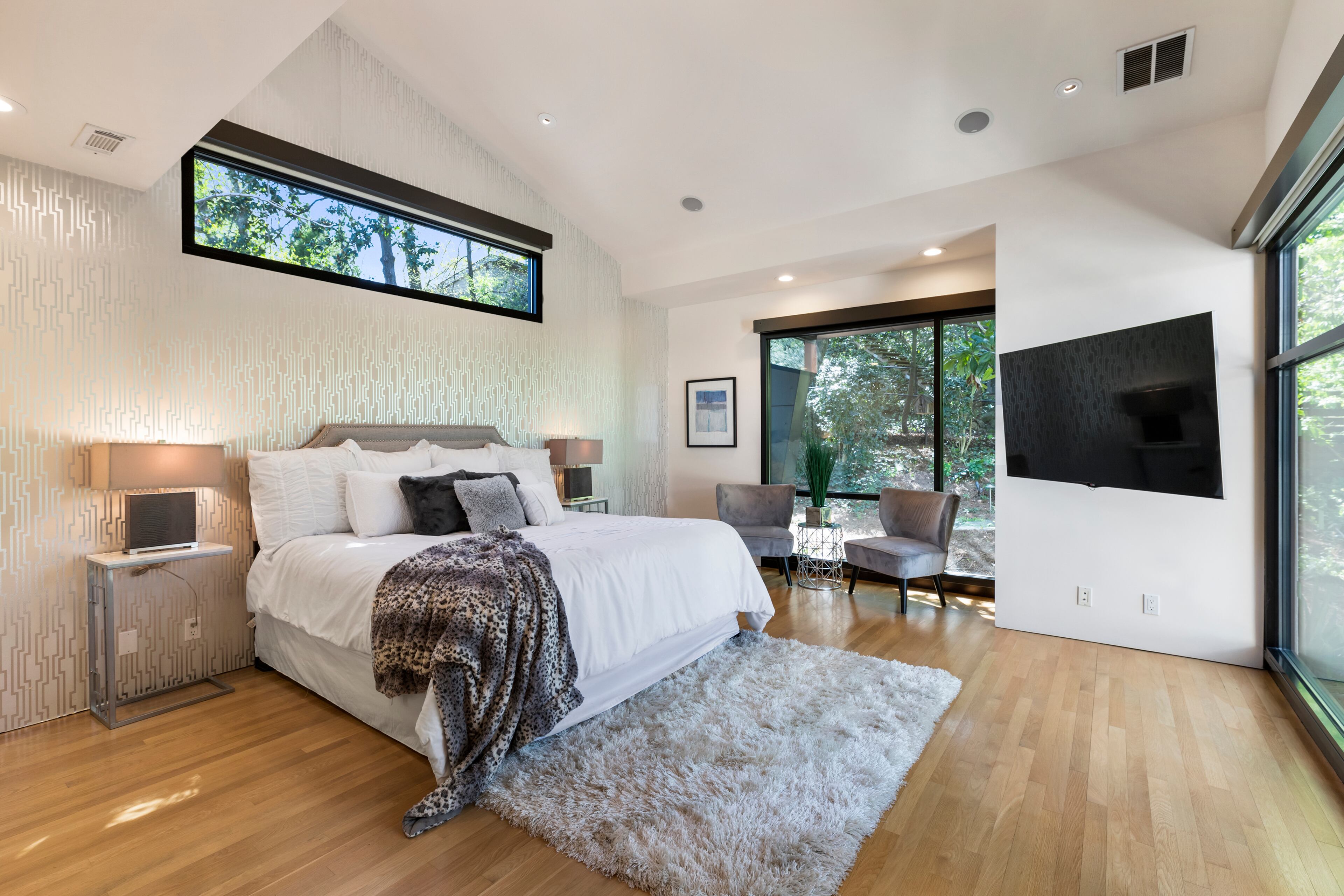 The primary bedroom has enough space for a seating area.