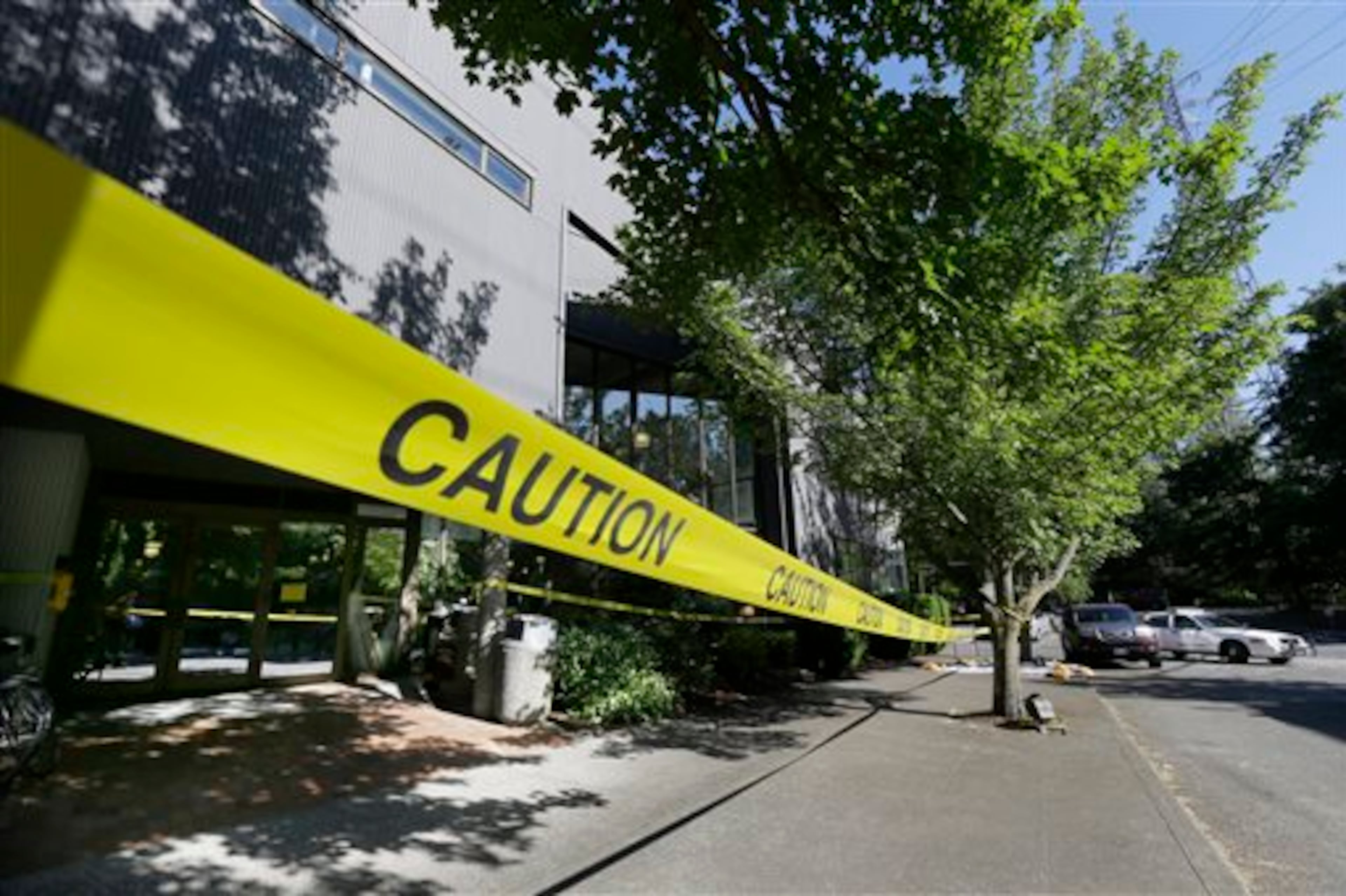 Police tape blocks the entrance to Otto Miller Hall at Seattle Pacific University Friday, June 6, 2014 in Seattle, where a shooting took place Thursday afternoon. A 19-year-old man was fatally shot and two other young people were wounded after a gunman entered the foyer and started shooting. Aaron R. Ybarra, 26, was booked into the King County Jail late Thursday for investigation of homicide, according to police and the jail roster. (AP Photo/Ted S. Warren)