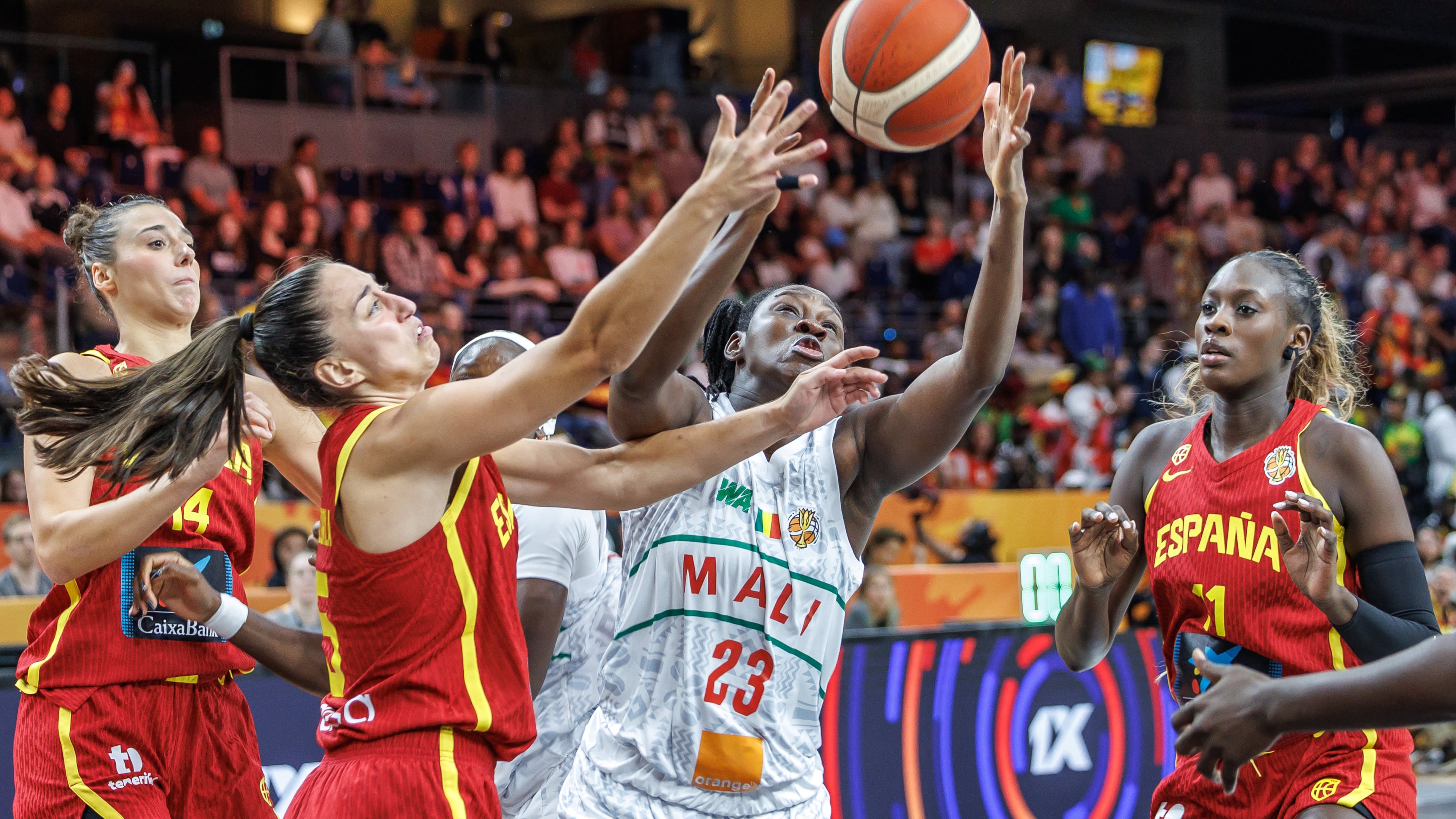 Mali's Sika Kone vies for the ball with Spain's Maite Cazorla, left, during the women's World Cup basketball match between Mali and Spain, in Berlin, Saturday, Sept. 5, 2026. (Andreas Gora/dpa via AP)