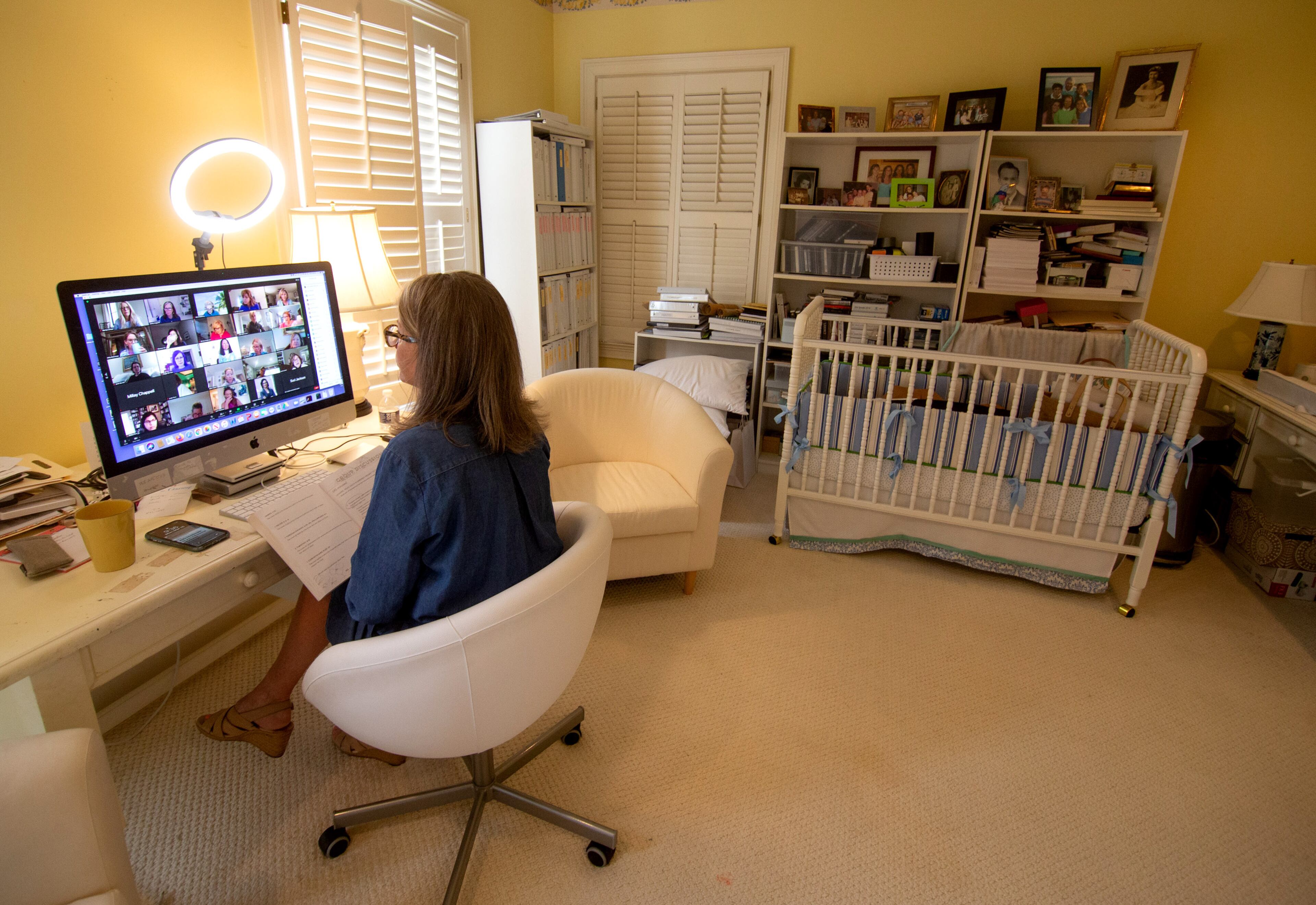 Nancy McGuirk talks with the leaders of her women's Bible study class during a Zoom call at her Atlanta home Monday, March 15, 2021. (Steve Schaefer for The Atlanta Journal-Constitution)