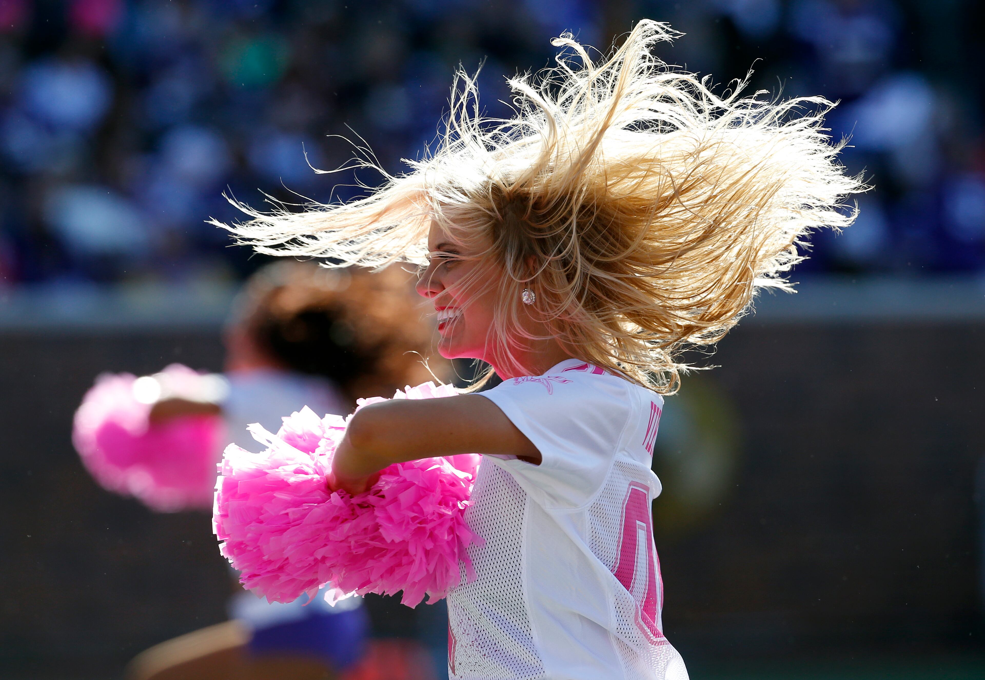 A cheerleader performs with pink pom-poms for breast cancer awareness during the second half of an NFL football game against the Kansas City Chiefs, Sunday, Oct. 18, 2015, in Minneapolis. The Vikings won 16-10. (AP Photo/Ann Heisenfelt)