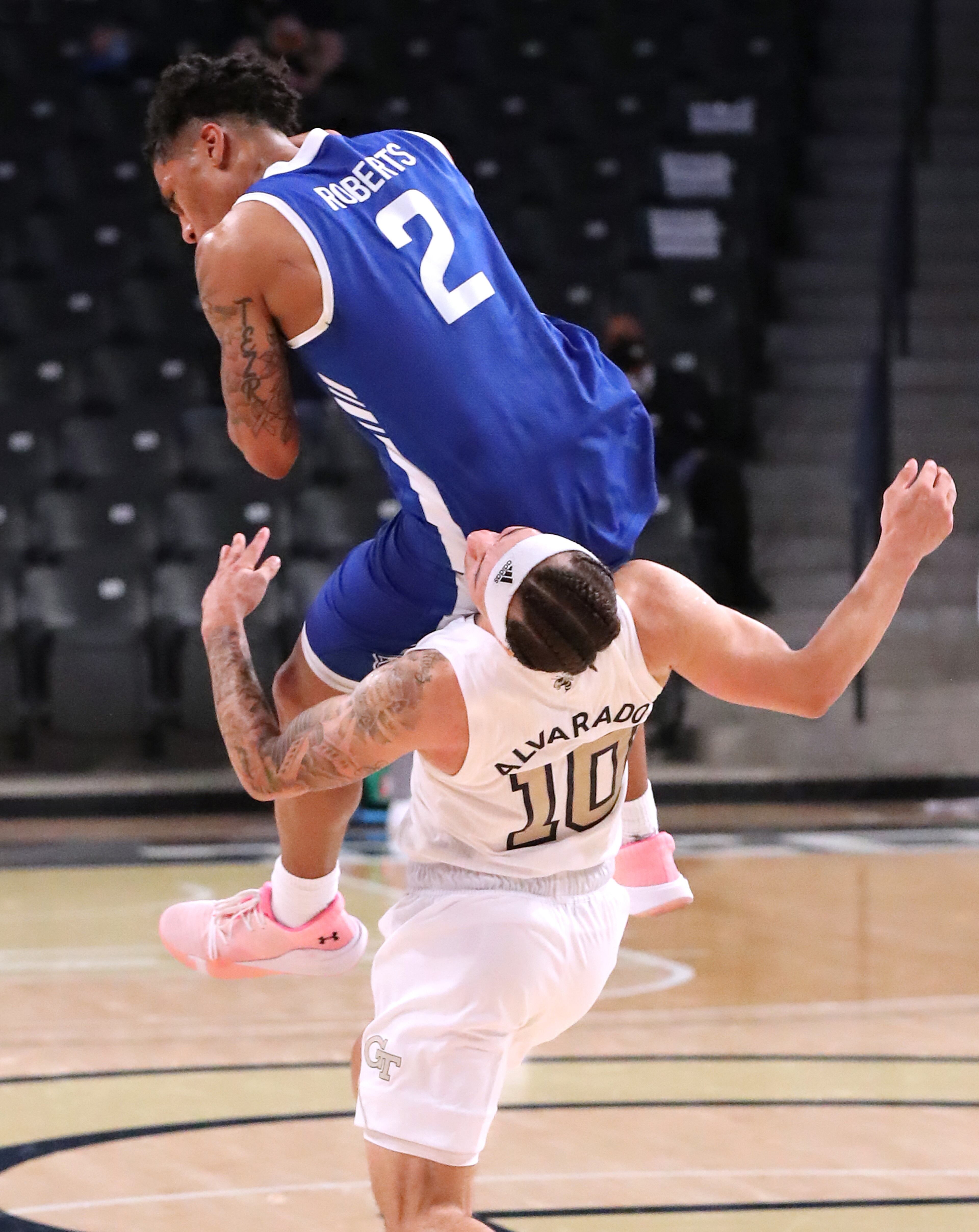Georgia Tech guard Jose Alvardo is called for a foul against Georgia State guard Justin Roberts during the second overtime. “Curtis Compton / Curtis.Compton@ajc.com”