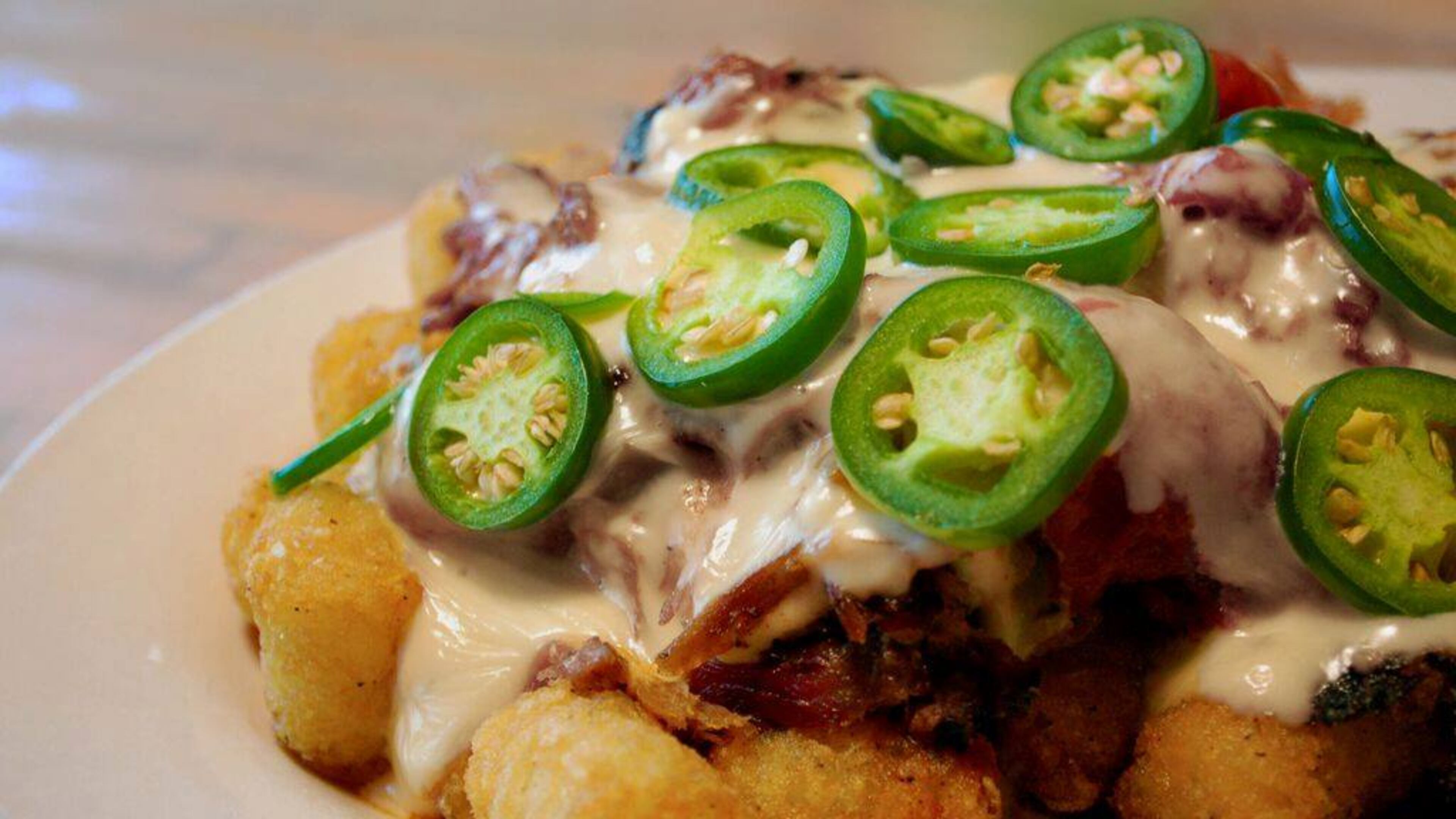 Bone Lick BBQ serves up these tots piled high with pork, cheese and jalapenos