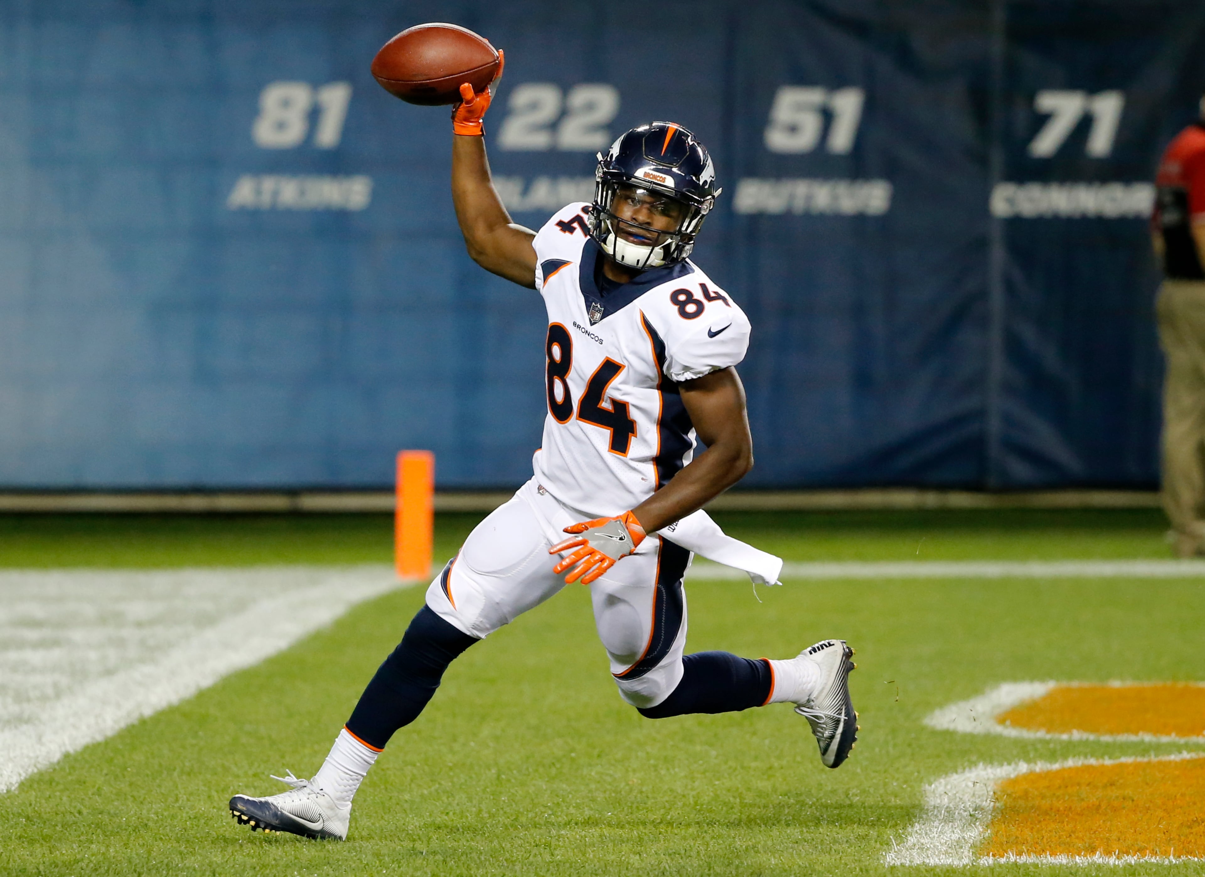 Denver Broncos wide receiver Isaiah McKenzie (84) celebrates a touchdown reception during the second half of an NFL preseason football game against the Chicago Bears, Thursday, Aug. 10, 2017, in Chicago. (AP Photo/Charles Rex Arbogast)