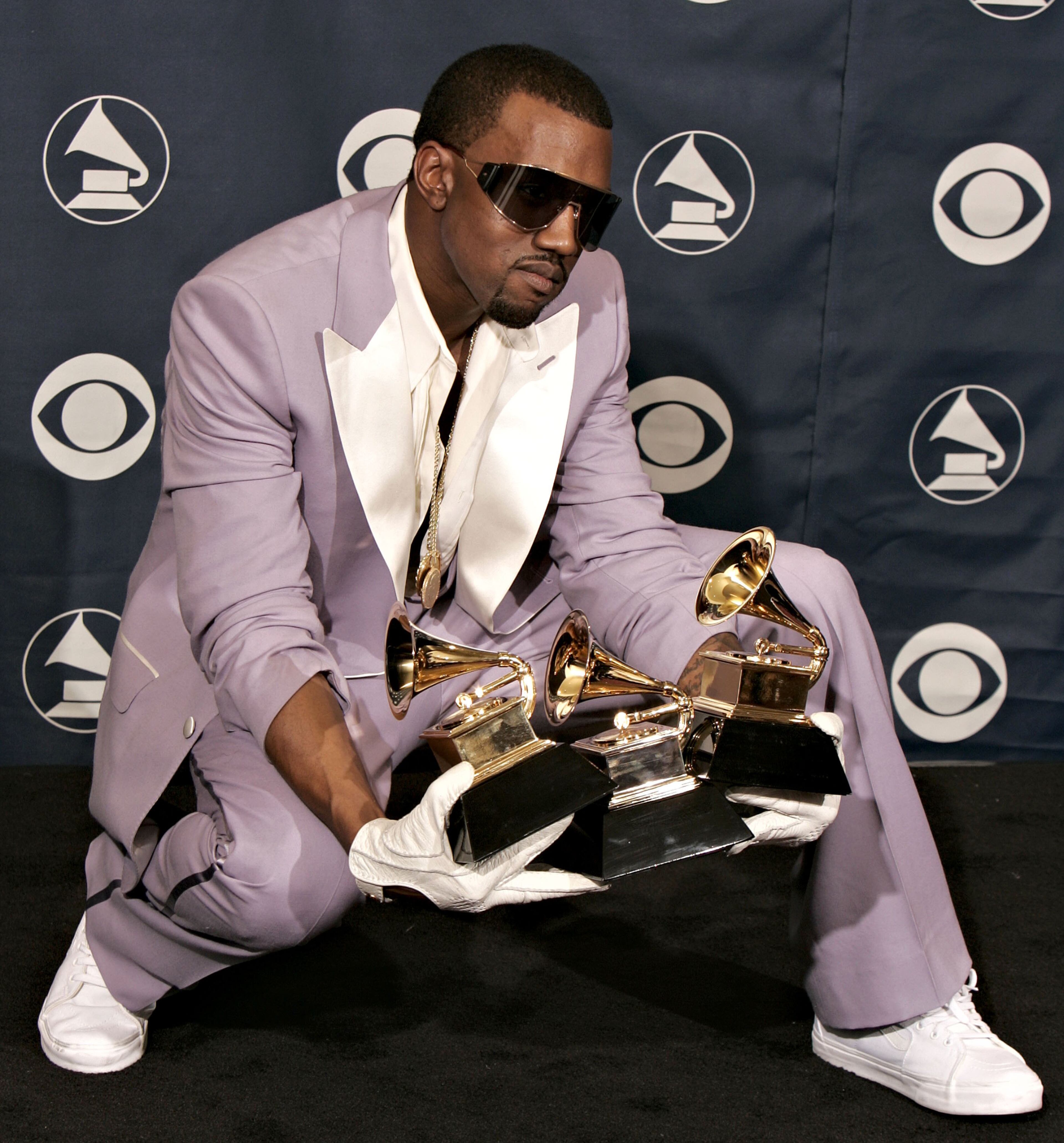 LOS ANGELES, CA - FEBRUARY 08: Singer Kanye West with his awards for Best Rap Song, Best Rap Solo Performance and Best Rap Album in the press room at the 48th Annual Grammy Awards at the Staples Center on February 8, 2006 in Los Angeles, California. (Photo by Kevin Winter/Getty Images)