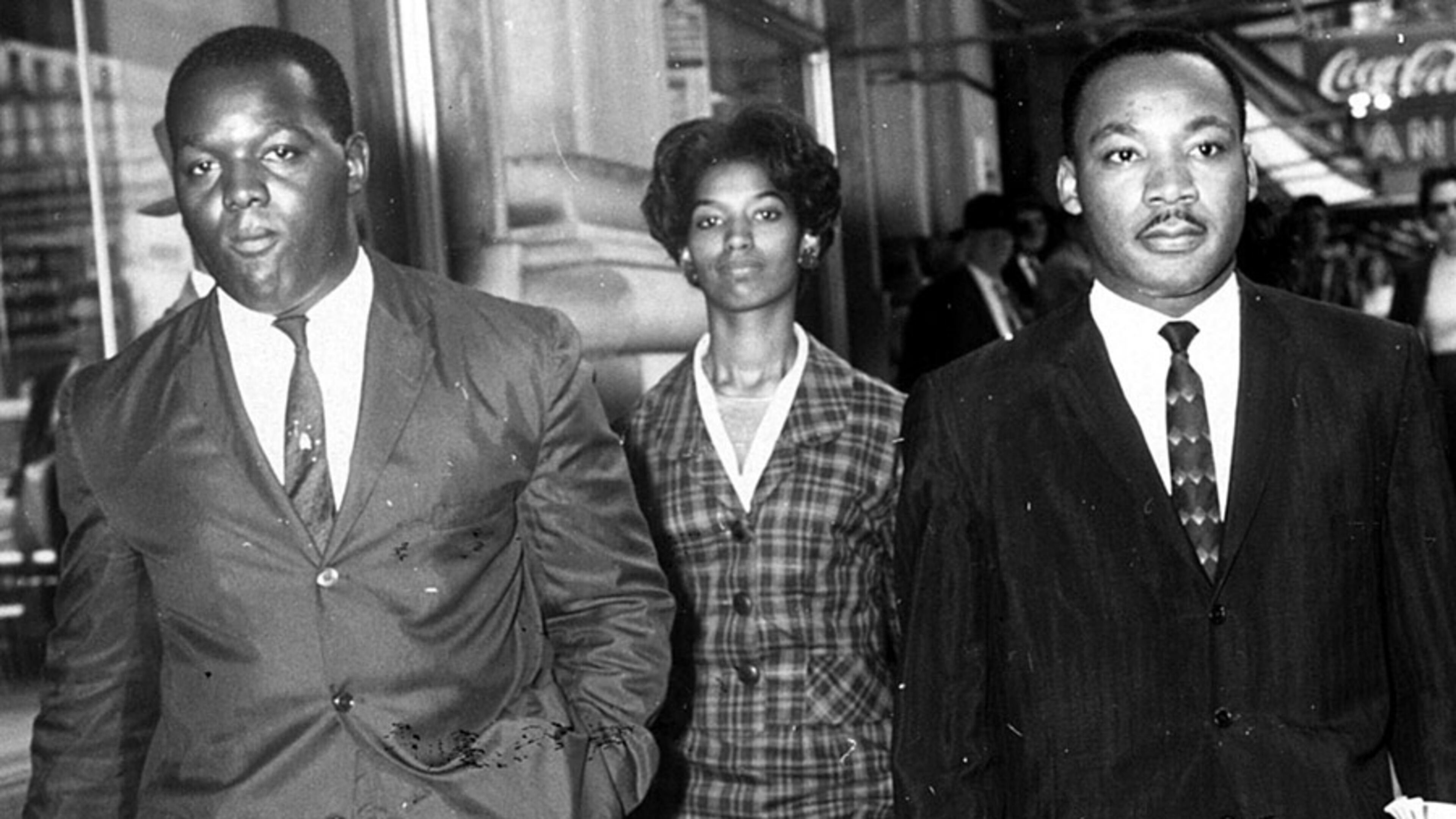 Demonstrators (l-r) Lonnie King, Marilyn Pryce (according to a source) and Martin Luther King Jr. are taken to a police car after being arrested for a sit-in protest at Rich’s. Their actions will be marked on Oct. 19, 2016 with a plaque at the location of the Rich’s Department Store protests. (Charles Jackson/AJC staff) 1960.