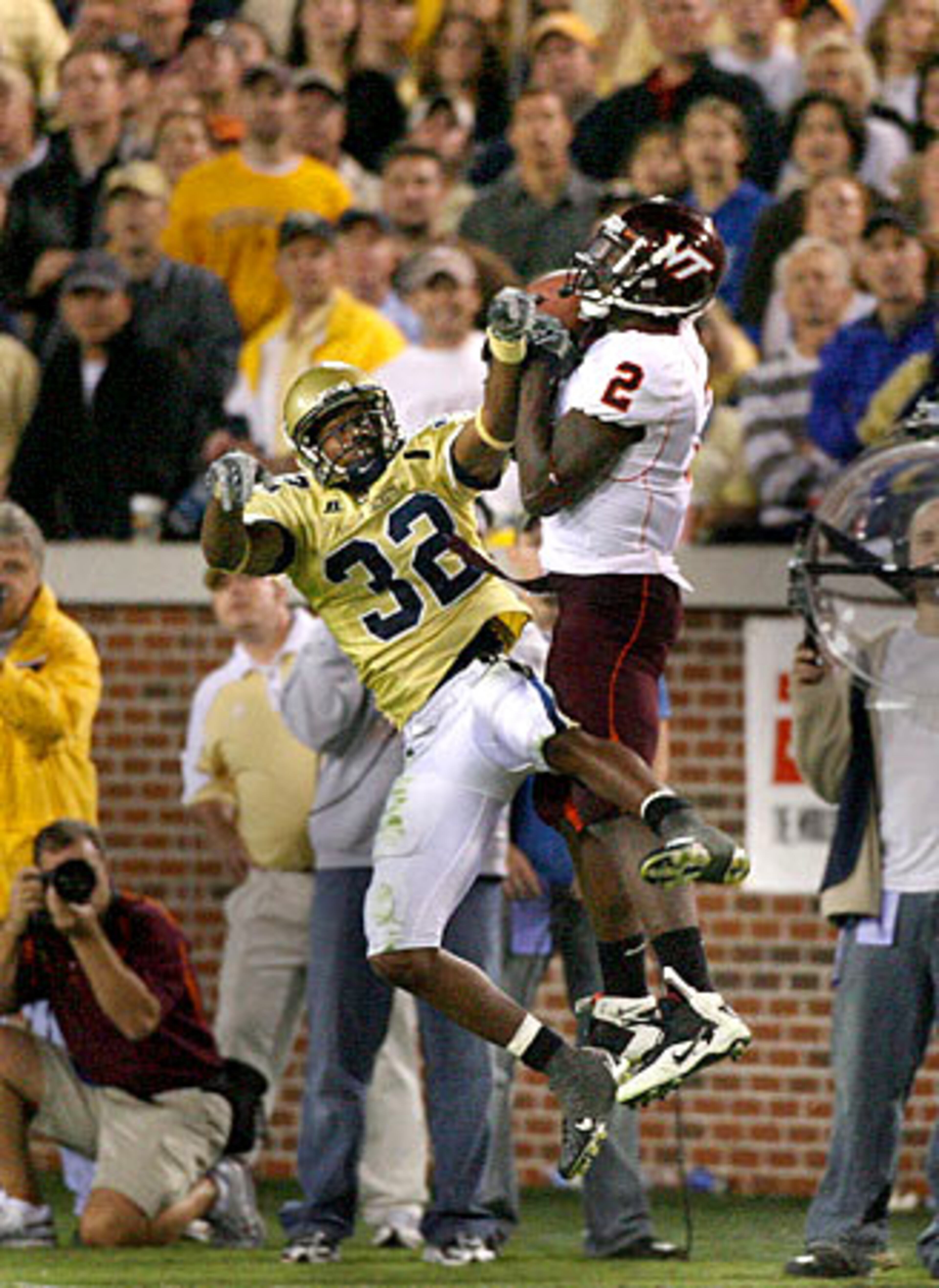 Virginia Tech's Josh Morgana (2) catches a pass that he ran in for a touchdown against Georgia Tech's Jahi Word-Daniels (32).