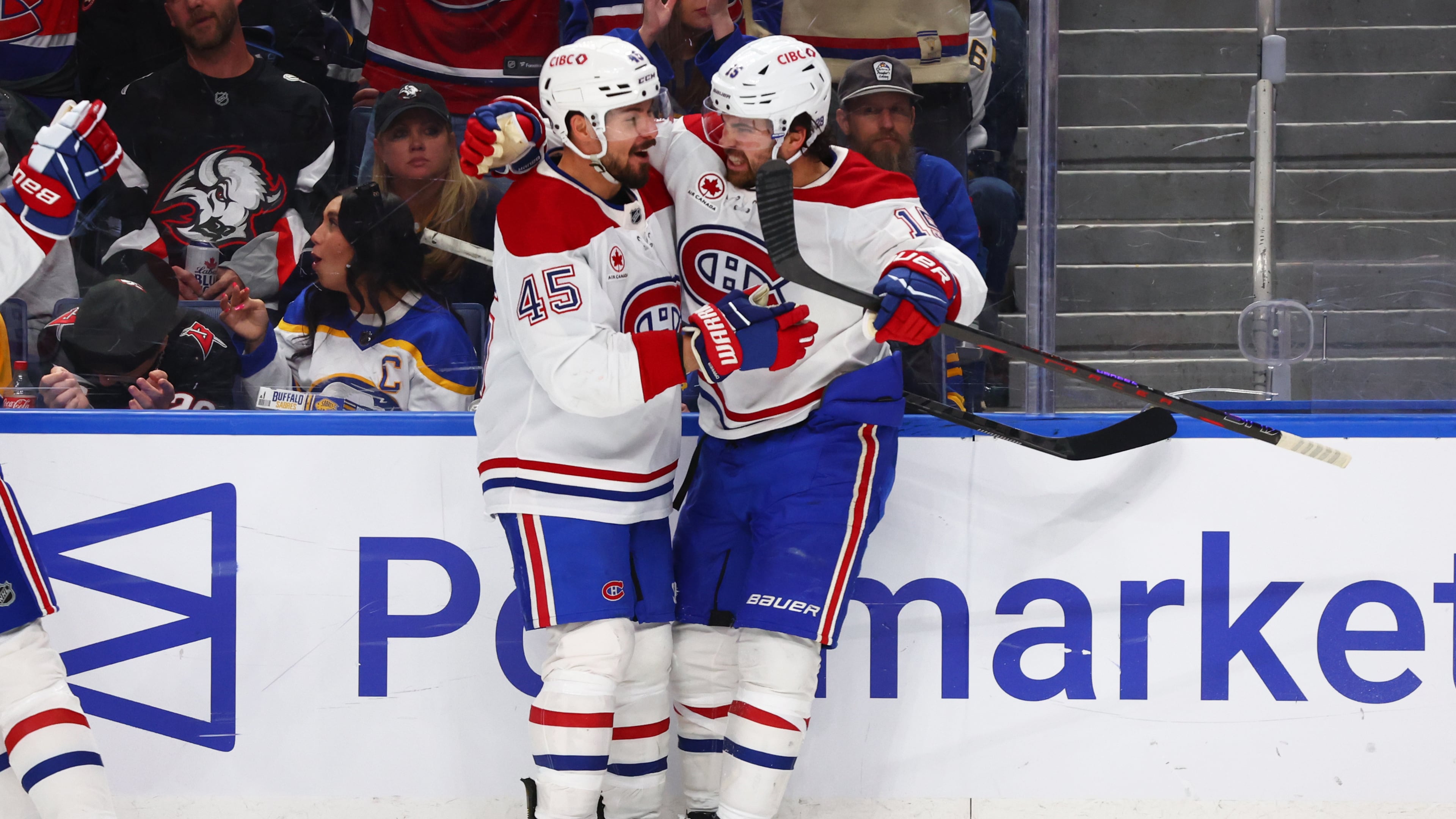 Montreal Canadiens center Alex Newhook (15) celebrates his goal with defenseman Alexandre Carrier (45) during the second period in Game 2 of a second-round NHL hockey Stanley Cup playoff series against the Buffalo Sabres Friday, May 8, 2026, in Buffalo, N.Y. (AP Photo/Jeffrey T. Barnes)