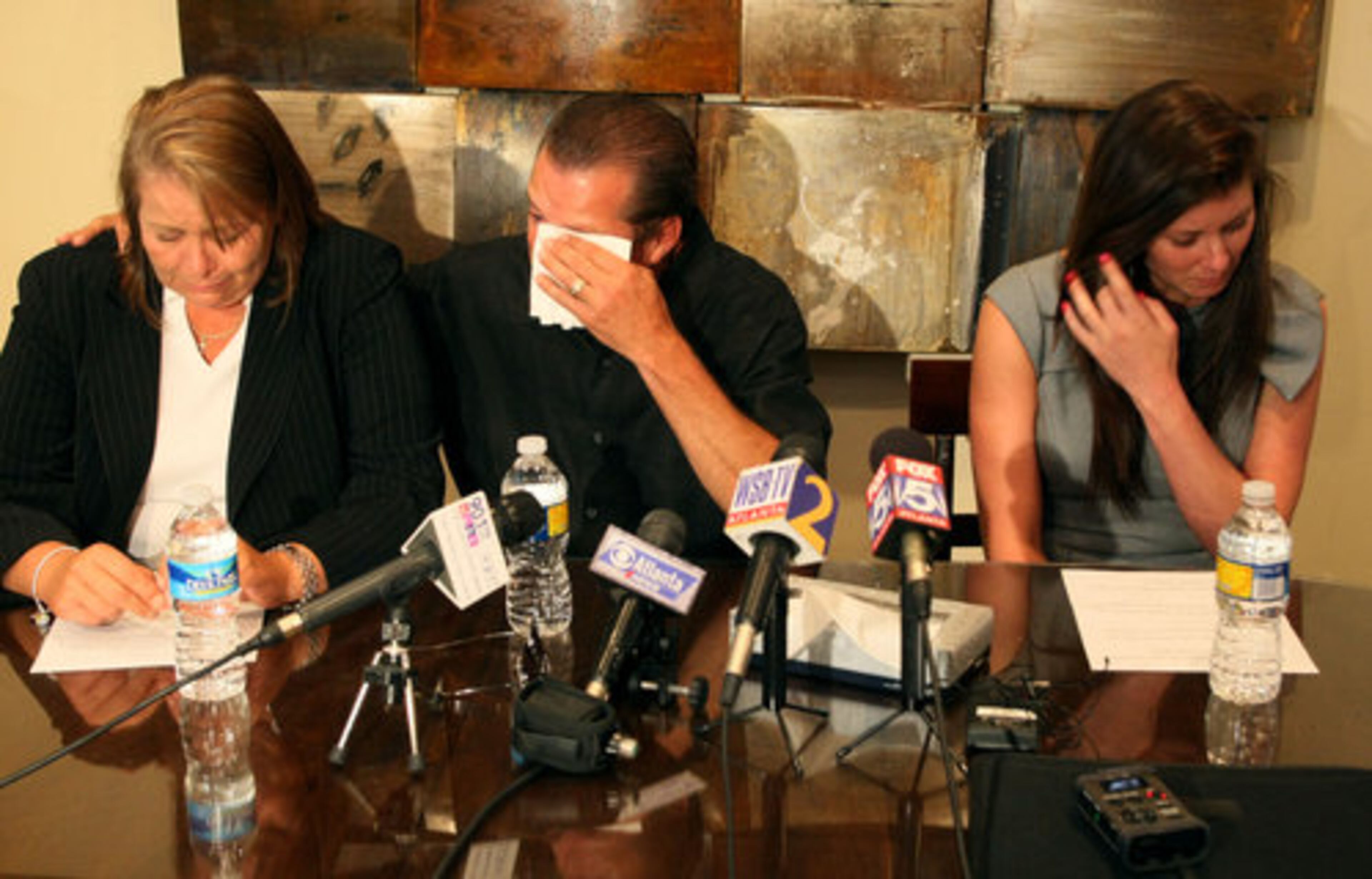 Jaeralynn, Steve & Christa Scott struggle with their emotions during a brief press conference at attorney David Wolfe's offices Thursday. The family wanted to express their regrets to the Griner family for the loss of their son in an car crash that Christa allegedly caused.