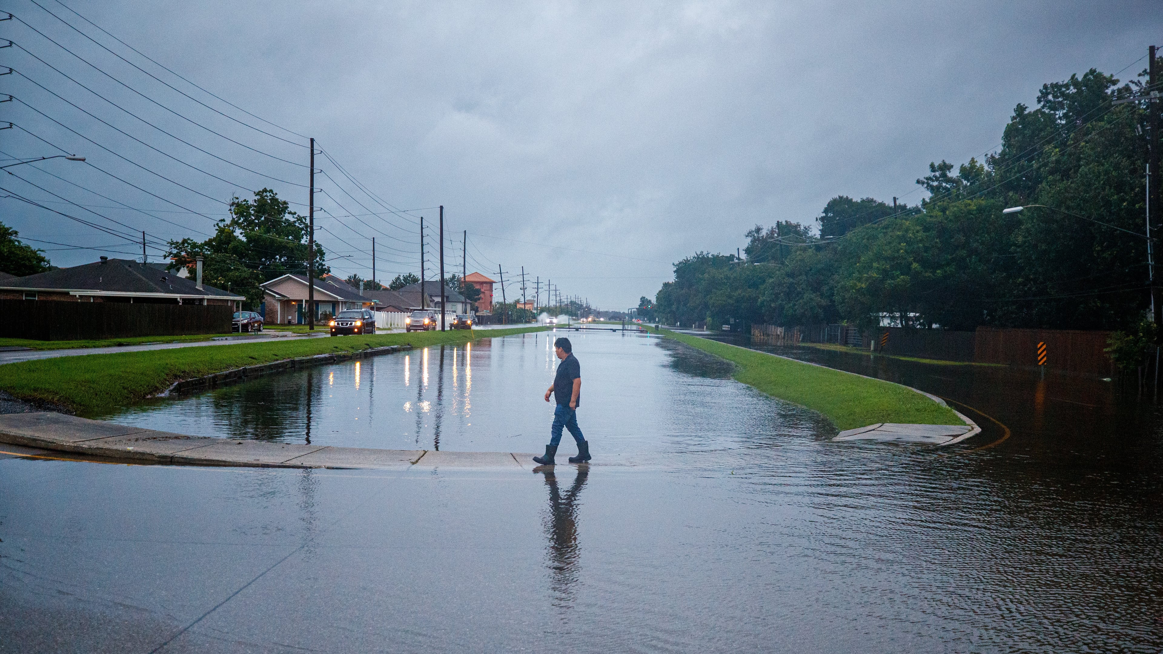 The West Esplanade Ave. canal in Kenner slowly recedes after over topping during Tropical Storm Arthur in New Orleans, Thursday, June 18, 2026. (David Grunfeld/The Times-Picayune/The New Orleans Advocate via AP)