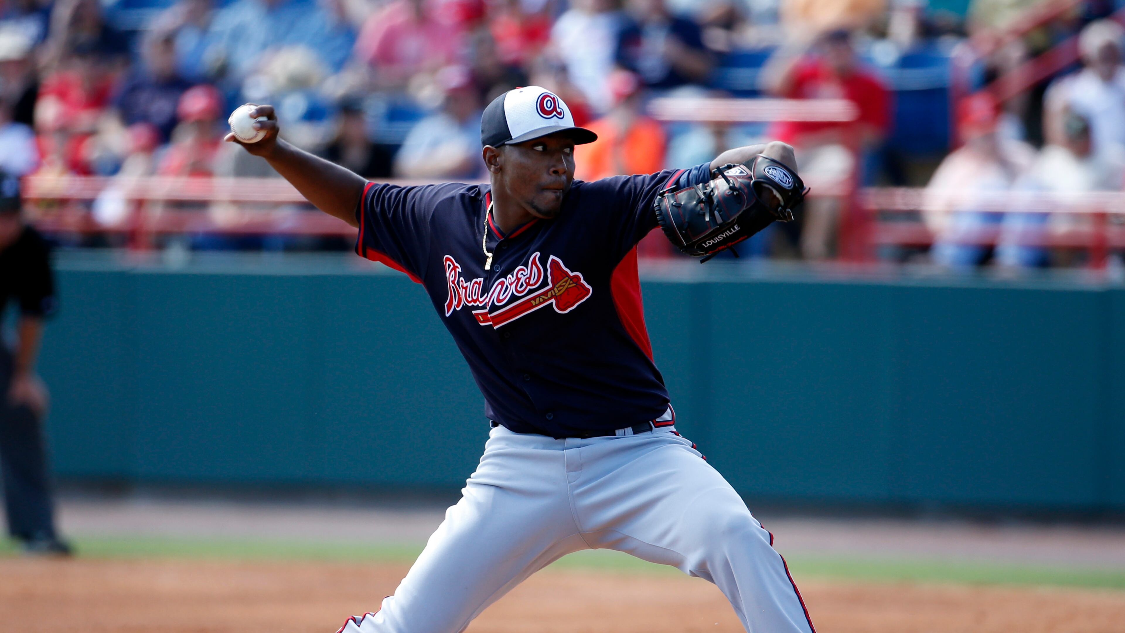 Atlanta Braves starting pitcher Julio Teheran throws in the first inning of a spring exhibition baseball game against the Washington Nationals, Saturday, March 1, 2014, in Viera, Fla. (AP Photo/Alex Brandon)
