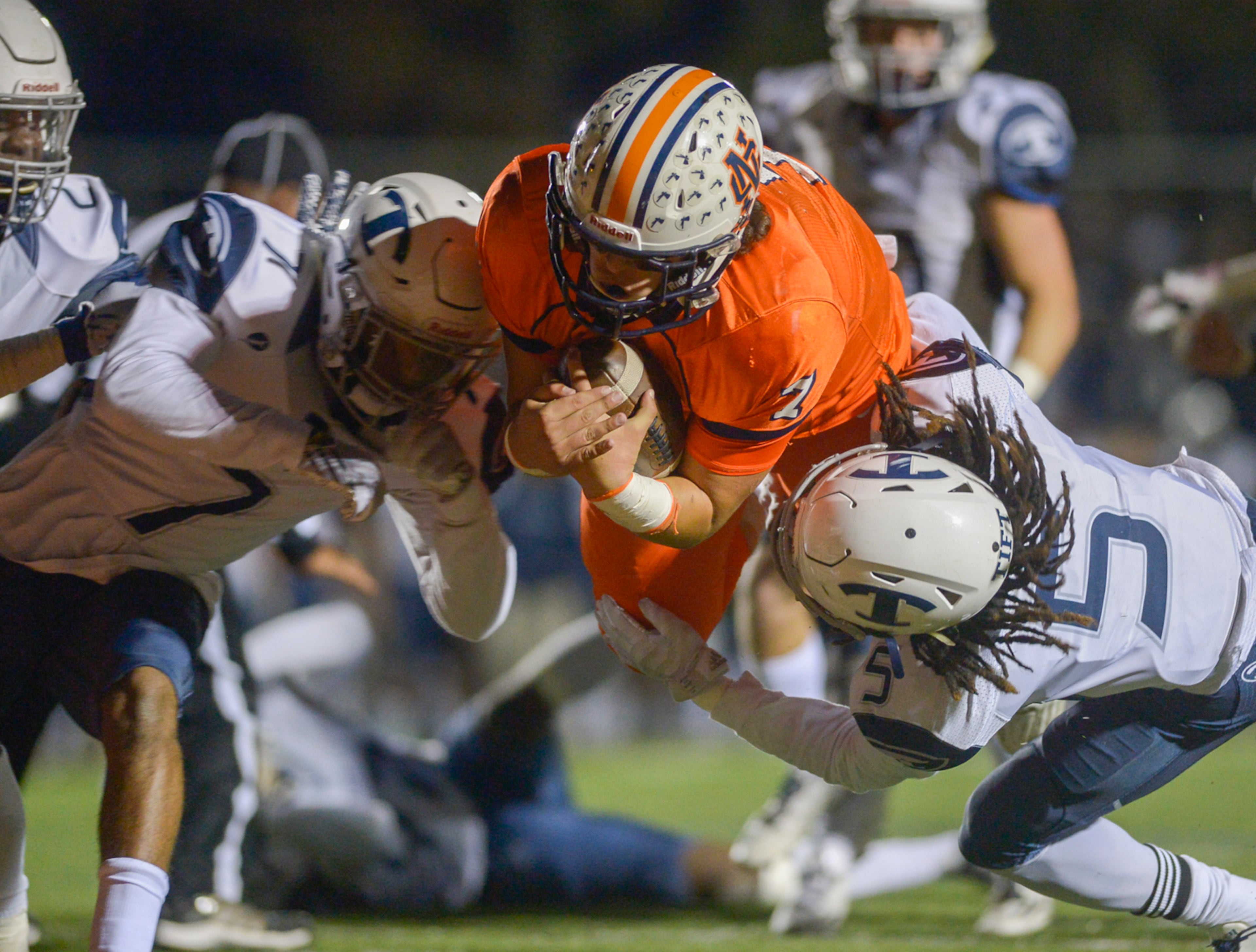 Kennesaw, Ga. -- Tift County junior DB Jakwon Golson (5) and the Blue Devil defense try to stop North Cobb senior QB Will Lovett (7) as he dives for the end zone in the first half of the game Friday November 11, 2016. SPECIAL/Daniel Varnado