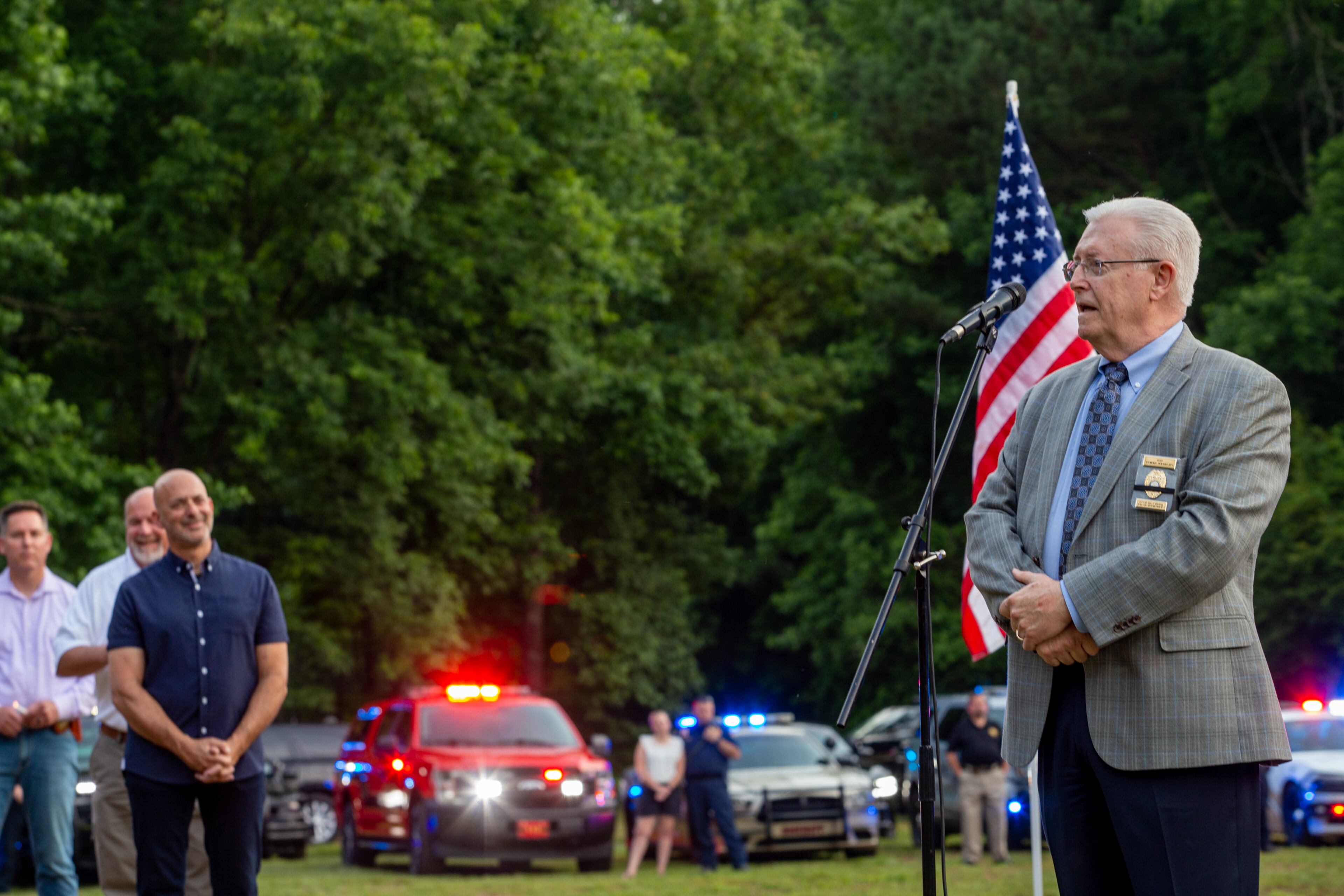Holly Springs Police Chief Tommy Keheley speaks at the candlelight vigil held at Barrett Park on Friday, June 18, 2021 for Joe Burson, who was killed during a traffic stop earlier this week. (Jenni Girtman for The Atlanta Journal-Constitution)