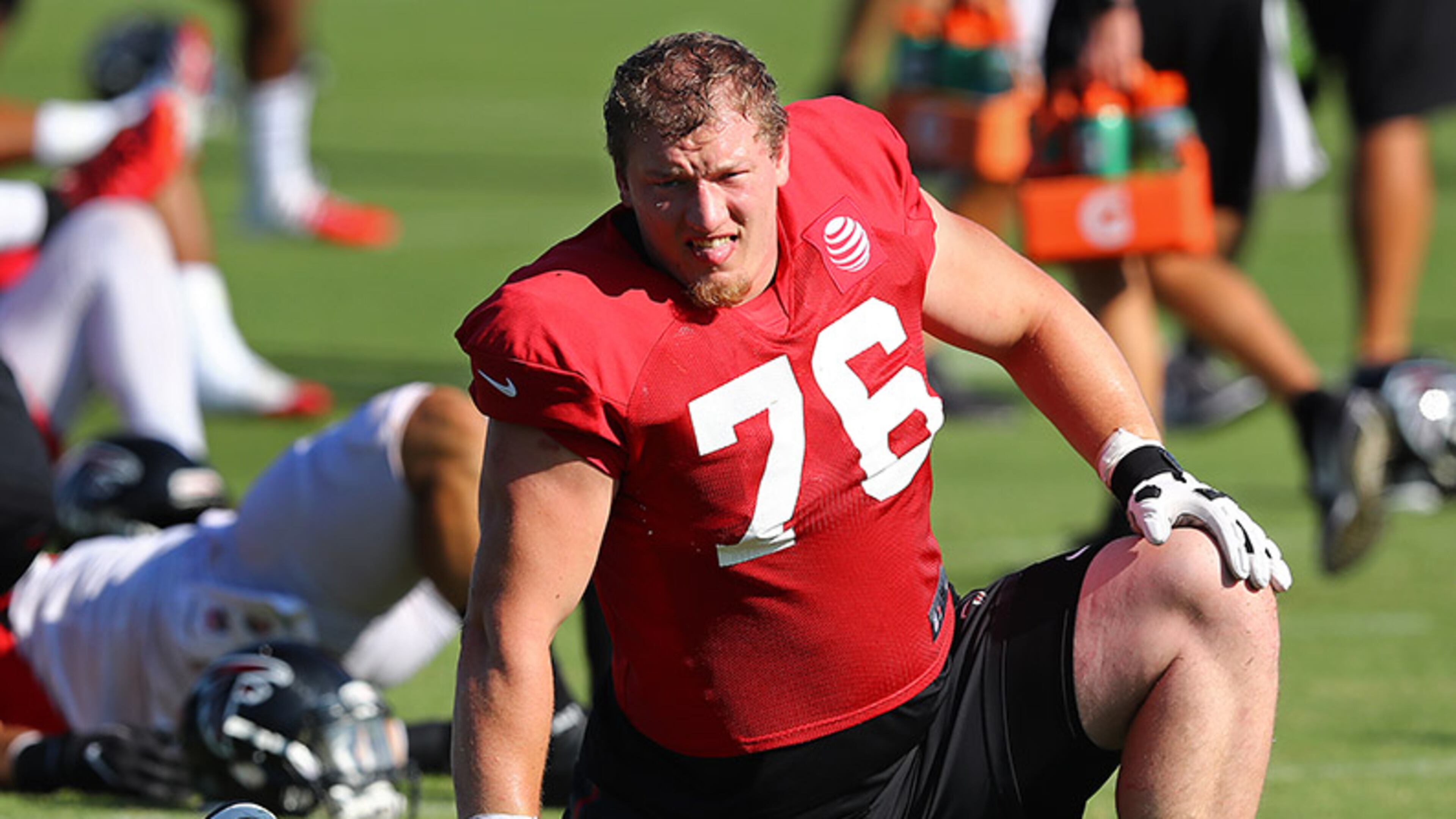 Falcons' rookie offensive tackle Kaleb McGary loosens up for training camp practice Thursday, July 25, 2019, in Flowery Branch.