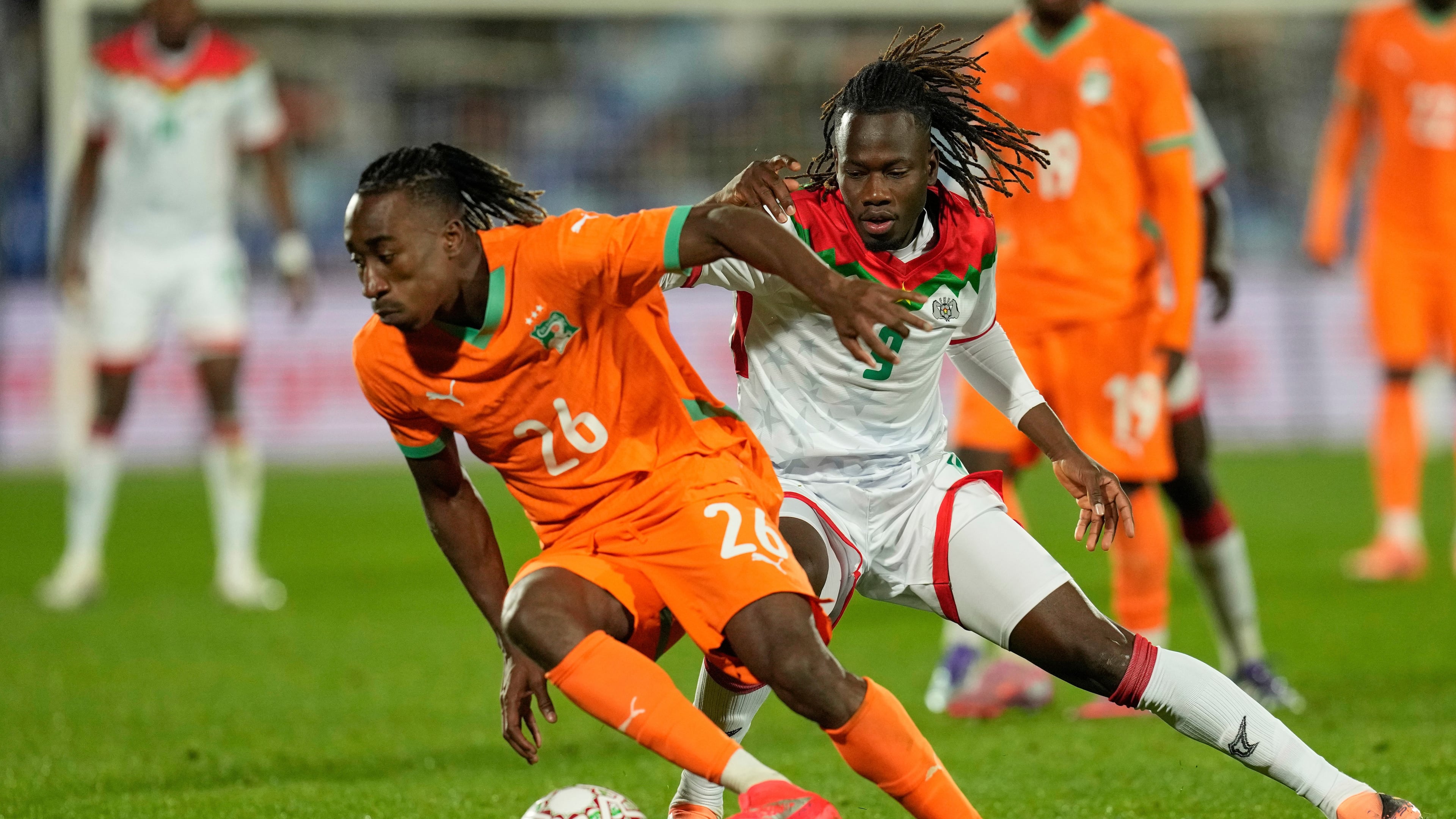 FILE - Ivory Coast's Yan Diomande, left, and Burkina Faso's Issa Kabore challenge during the Africa Cup of Nations best of 16 soccer match between Ivory Coast and Burkina Faso in Marrakech, Morocco, on Jan. 6, 2026. (AP Photo/Themba Hadebe, File)