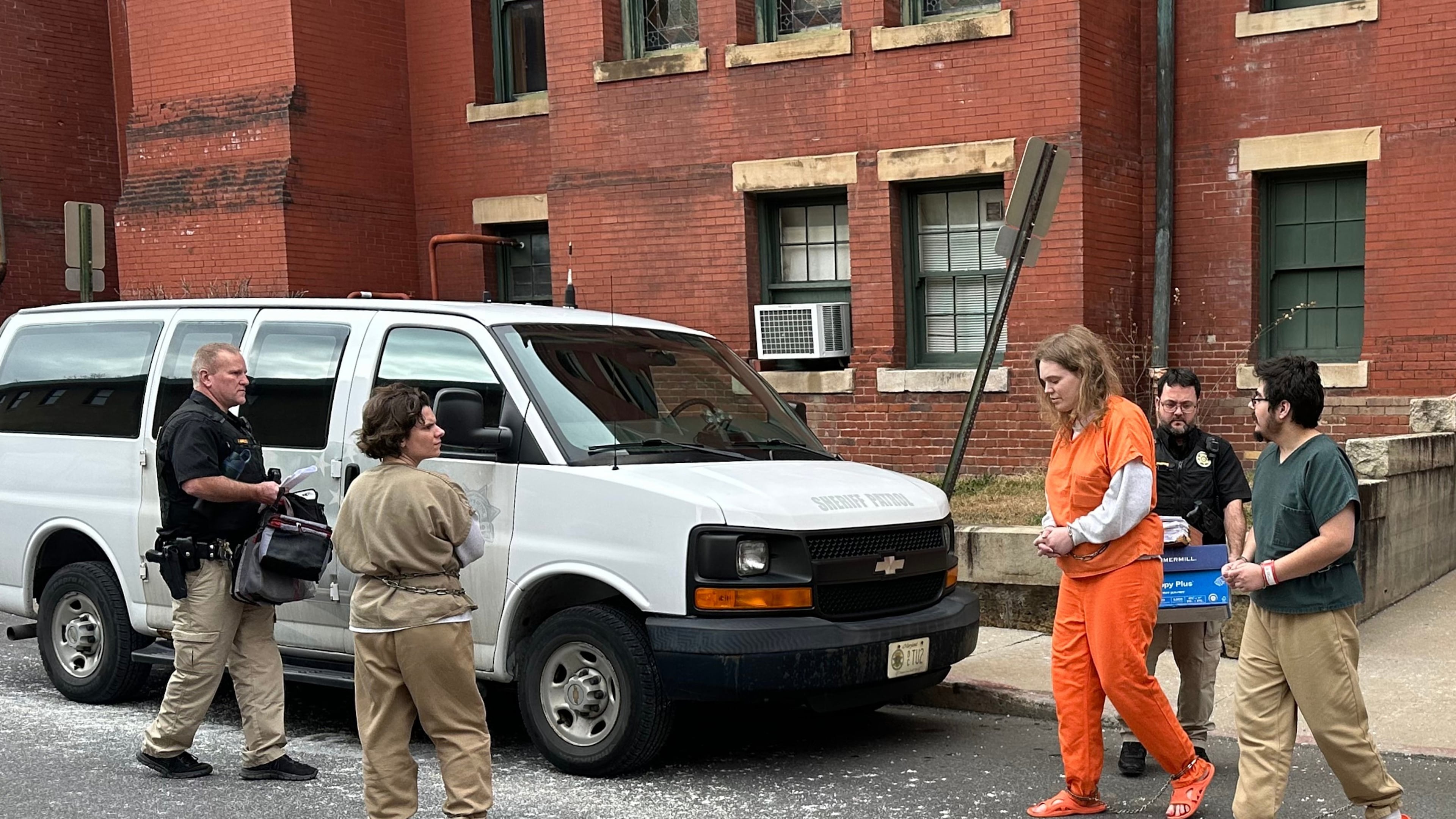 Deputies escort Michelle Zajko, left, Daniel Blank, right, and Jack LaSota, in orange, from the Allegany County Courthouse after a pretrial hearing in Cumberland, Md., on Friday, January 16, 2026. (AP Photo/Mark Scolforo)