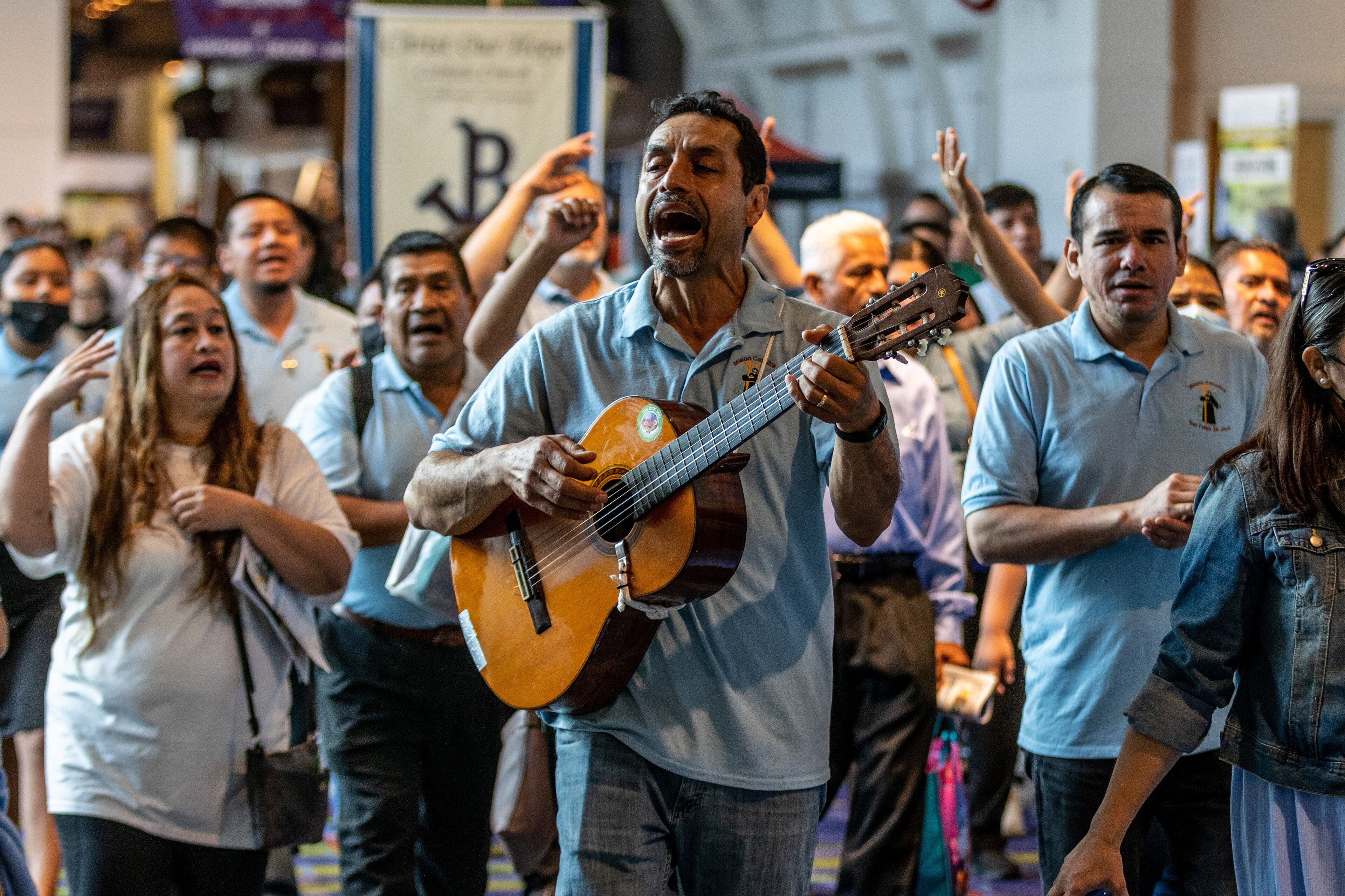 Groups walk through the Georgia International Convention Center in College Park at the beginning of the 25th Eucharistic Congress Saturday, June 18, 2022. (Steve Schaefer / steve.schaefer@ajc.com)