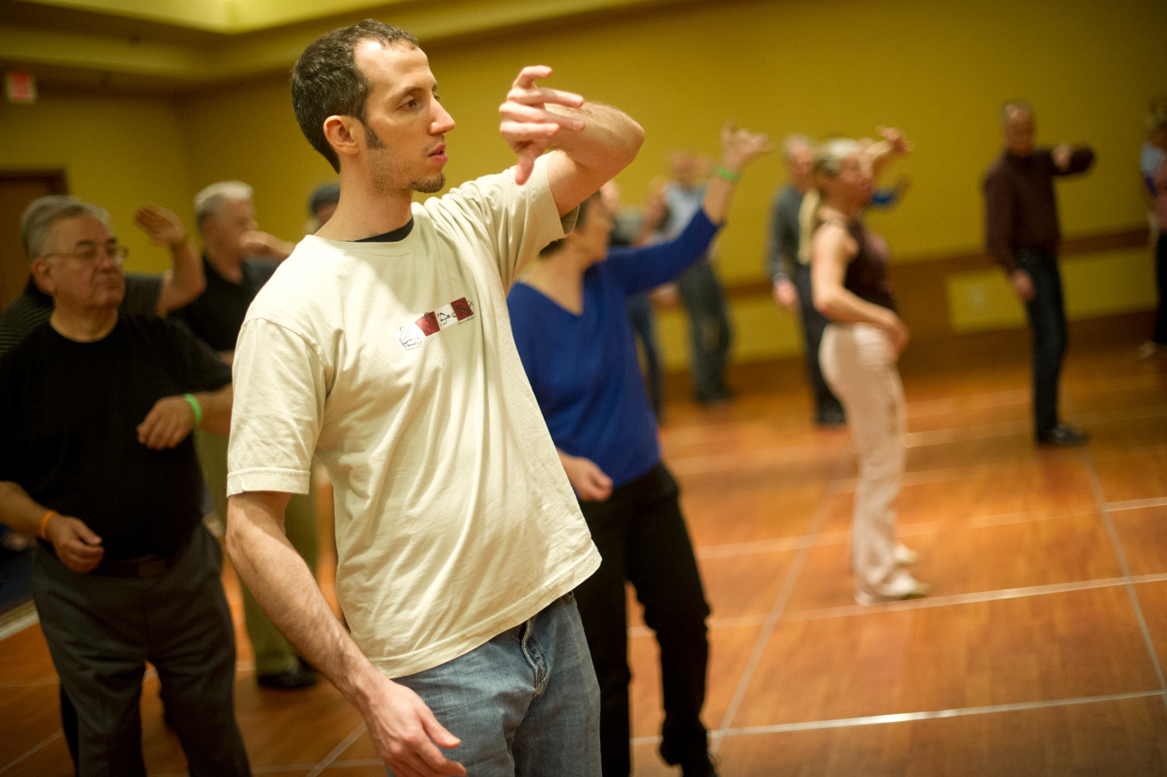John Erdelt (left) learns steps to the cha cha during the Peach State Dance Festival at the Crown Plaza Ravinia hotel in Atlanta on Saturday, March 22, 2014. Approximately 1,000 country, swing and line dancers filled the hotel in Dunwoody for a weekend of instruction, competition, social dancing, and dance performances. The festival is in its 24th year and is the largest of its kind in the southeast.