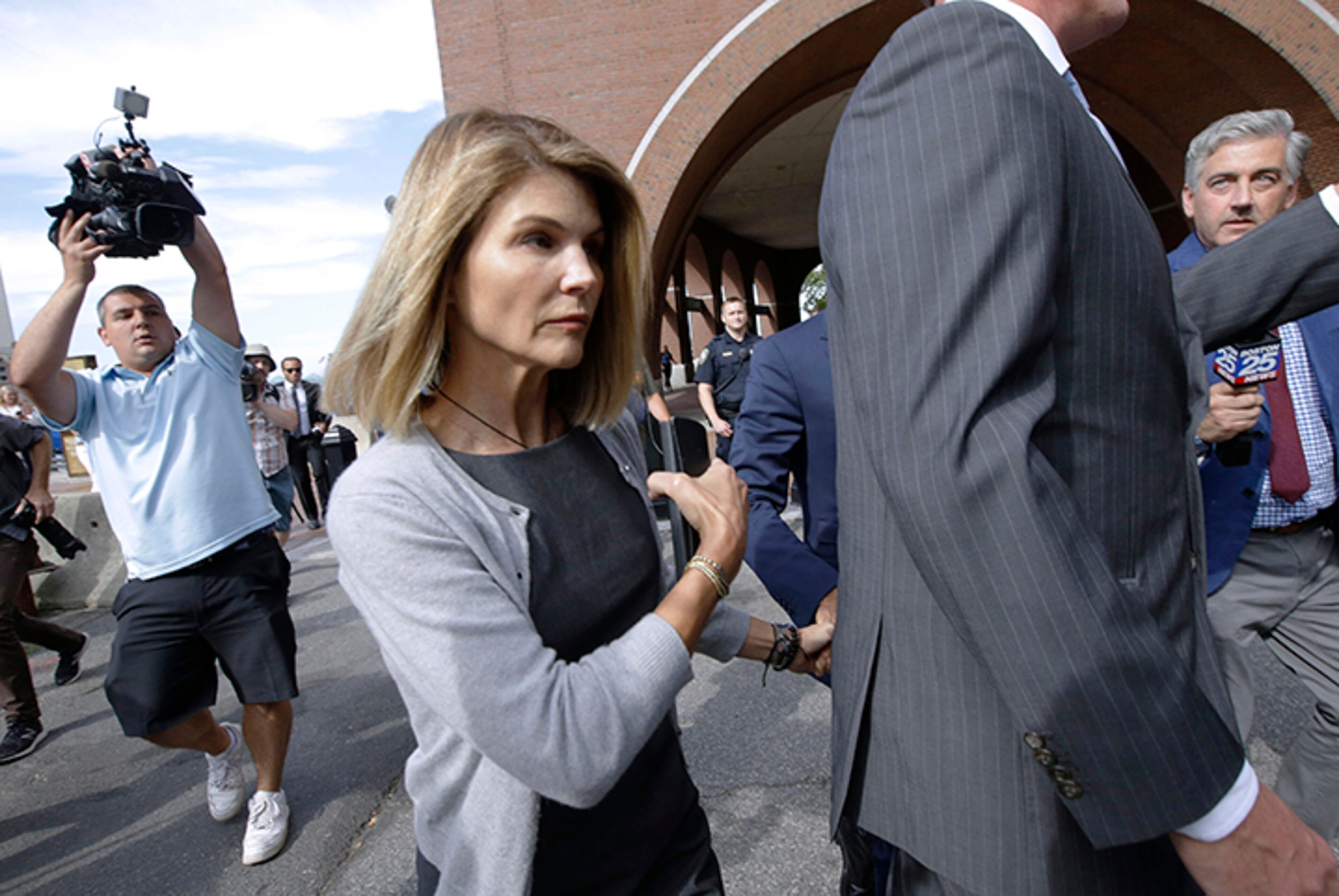 Actress Lori Loughlin and her fashion designer husband Mossimo Giannulli are fighting expanded charges against them in the college admissions bribery scandal.