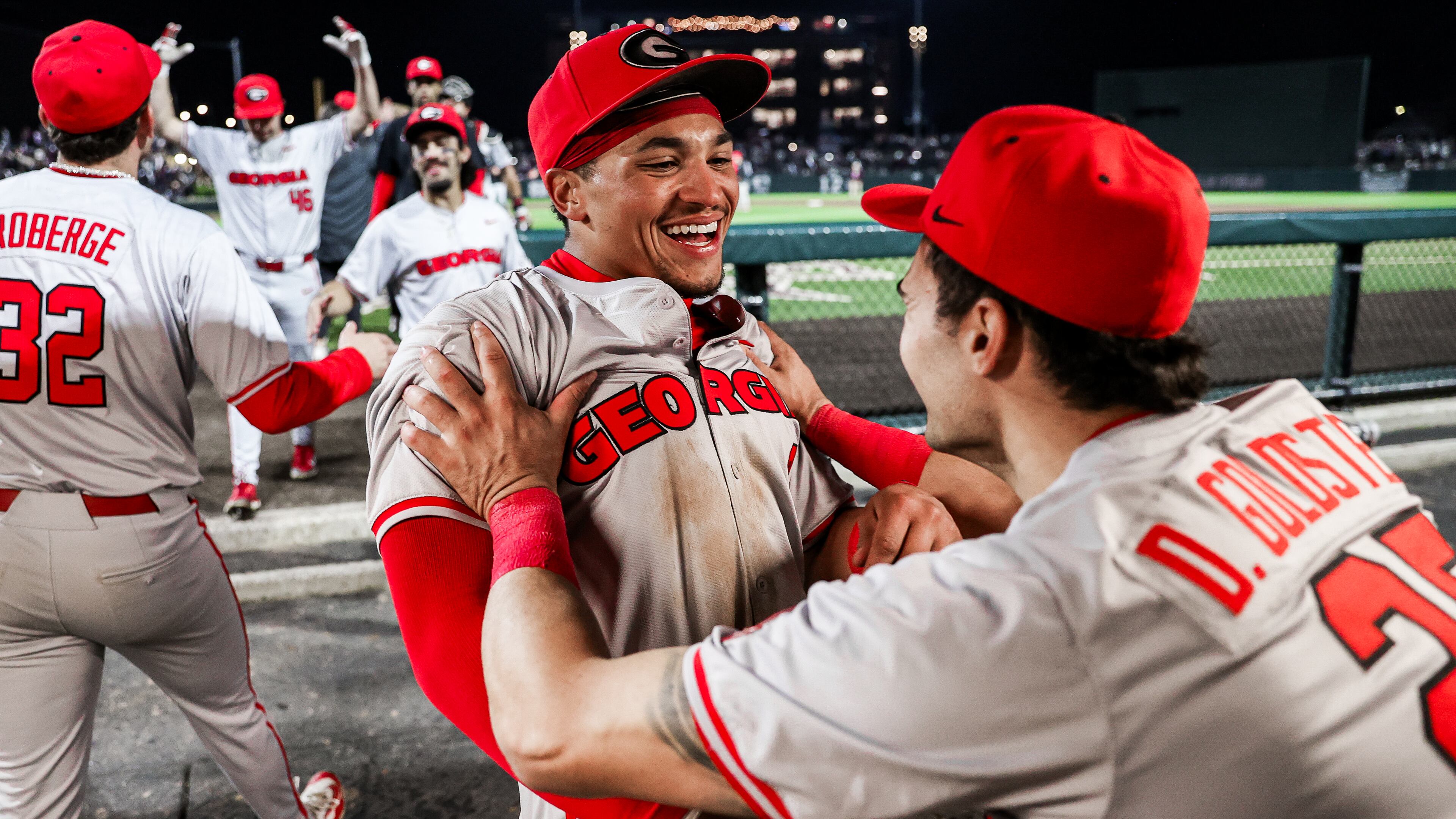 Georgia outfielder Clayton Chadwick (8) is congratulated by teammate Dylan Goldstein after hitting what stood up as the game-winning home run in the toip of the ninth inning of the Bulldogs game against Mississippi State at Dudy Noble Field in Starkville, Miss., on Saturday, April 06, 2024. (Kari Hodges/UGA Athletics)