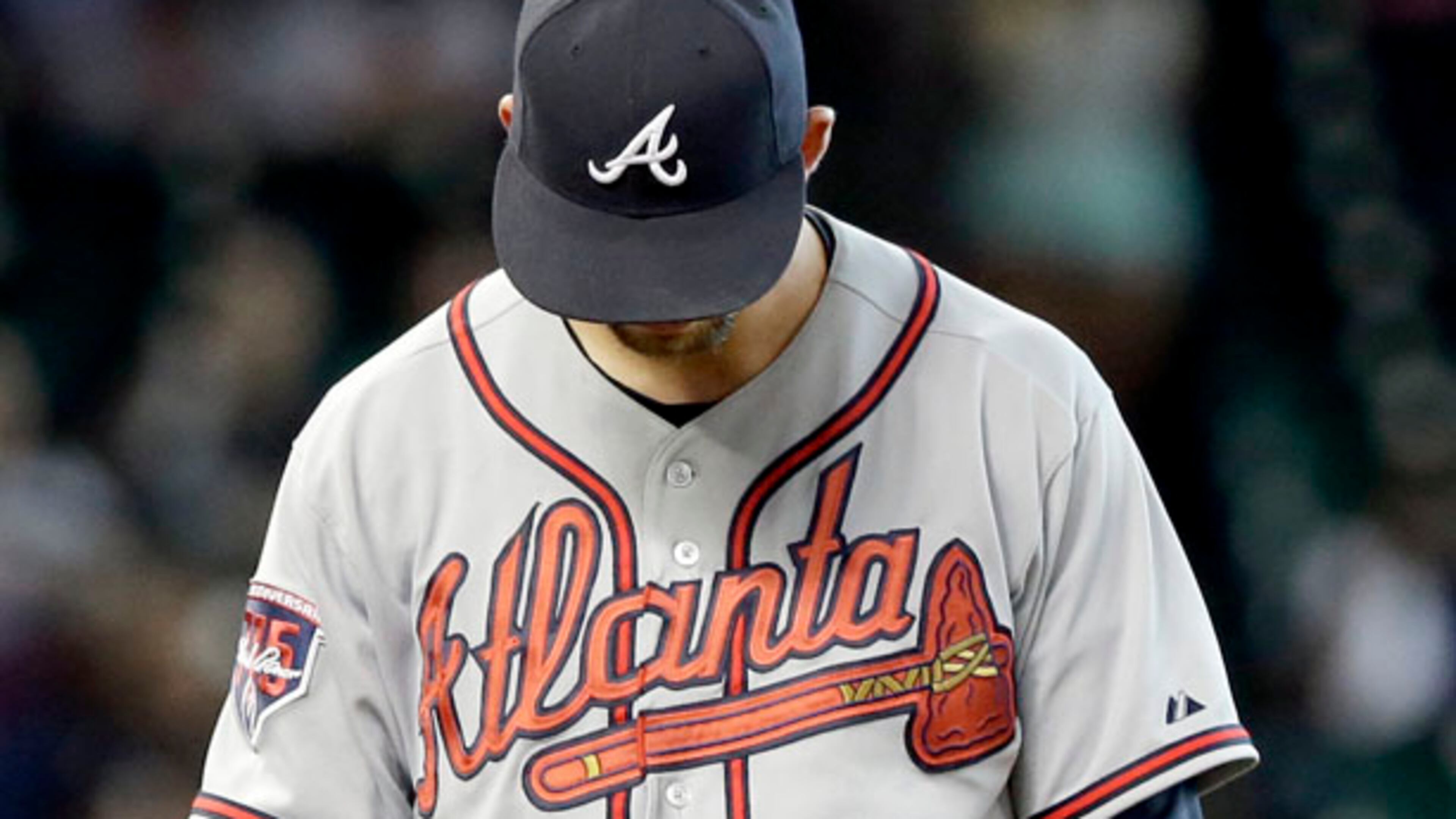 Atlanta Braves starting pitcher Mike Minor hangs his head after giving up a three-run homer to Houston Astros' Matt Dominguez in the fifth inning of a baseball game Thursday, June 26, 2014, in Houston. (AP Photo/Pat Sullivan)