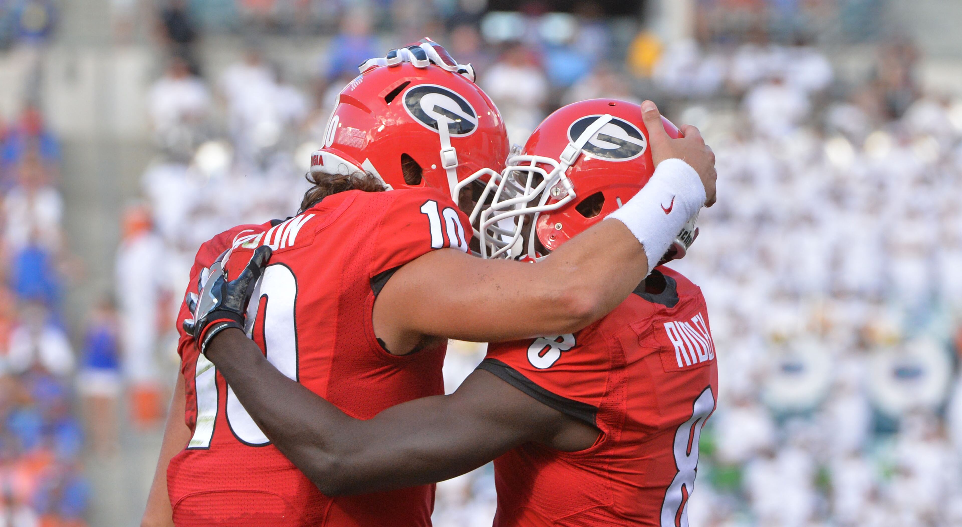 October 29, 2016 Jacksonville, Fla. - Georgia quarterback Jacob Eason (10) and Georgia wide receiver Riley Ridley (8) celebrate after Radley scored a touchdown in the first half of Georgia and Florida game at EverBank Field in Jacksonville, Florida on Saturday, October 29, 2016. HYOSUB SHIN / HSHIN@AJC.COM