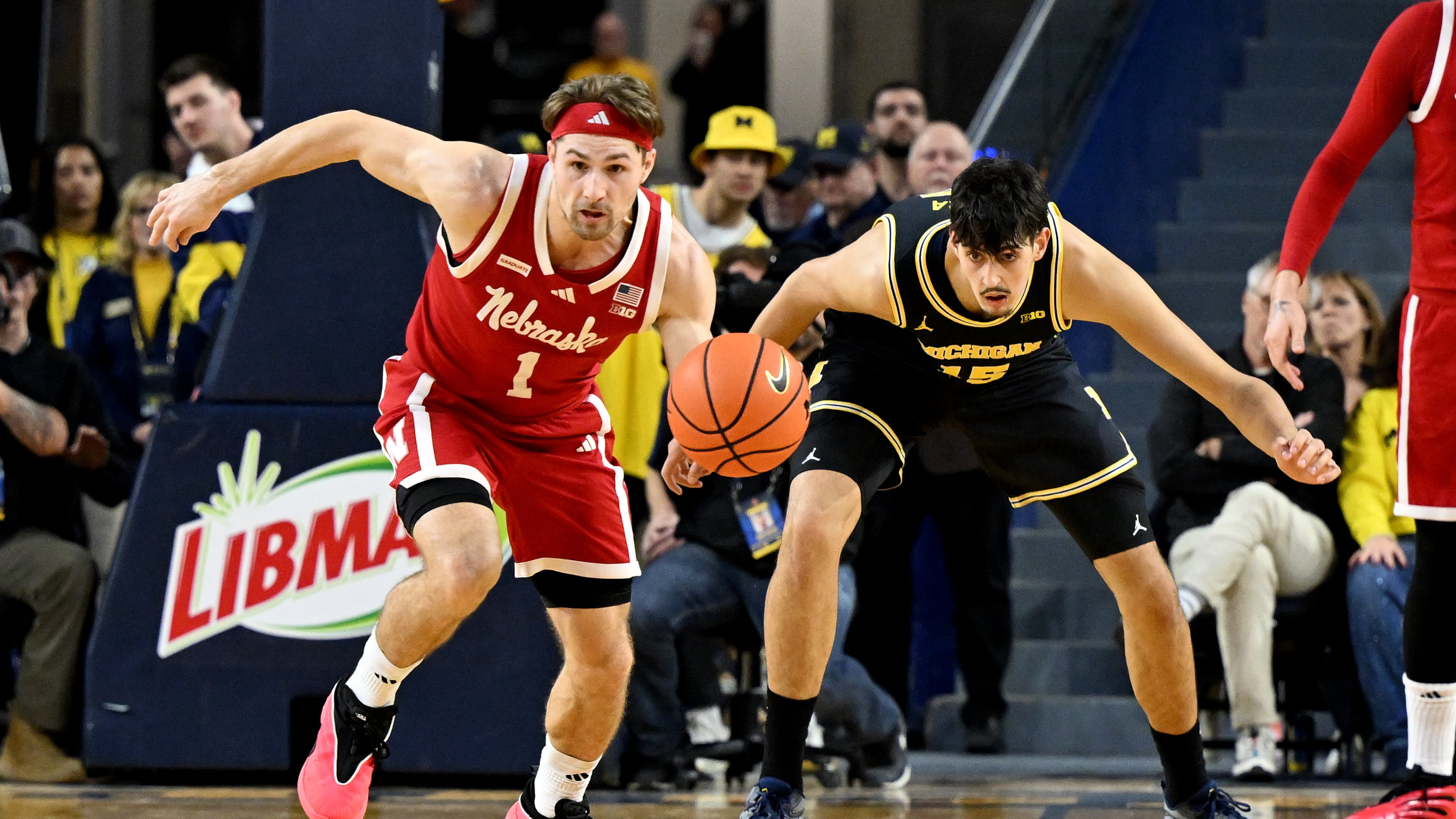 Nebraska guard Sam Hoiberg (1) steals the ball from Michigan center Aday Mara (15) in the first half of an NCAA college basketball game in Ann Arbor, Mich., Tuesday, Jan. 27, 2026. (AP Photo/Lon Horwedel)