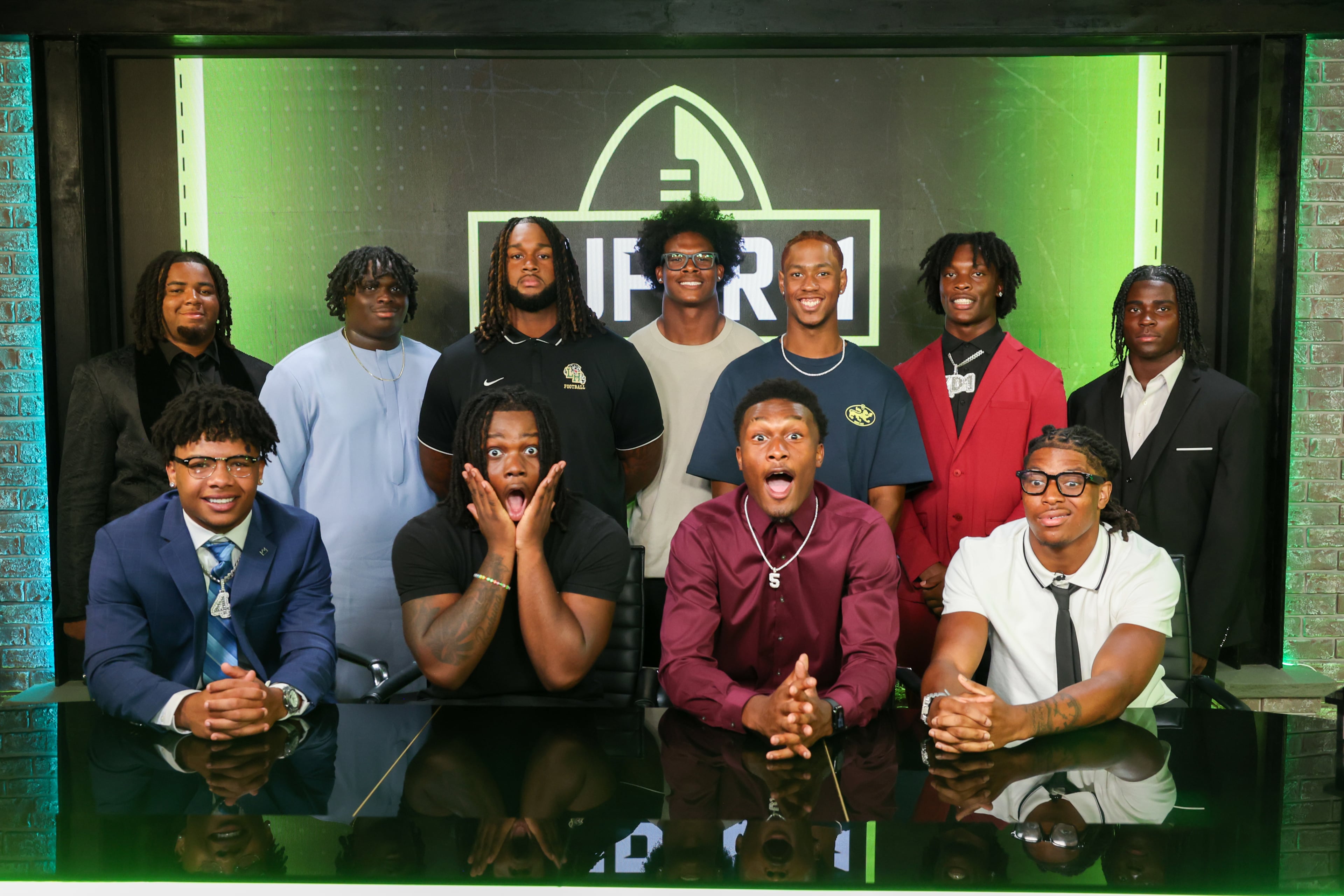 The Super 11 Class of 2026 pose for a portrait at the Super 11 reveal show at Score ATL in Roswell on Aug. 3, 2026. (Arvin Temkar/AJC)