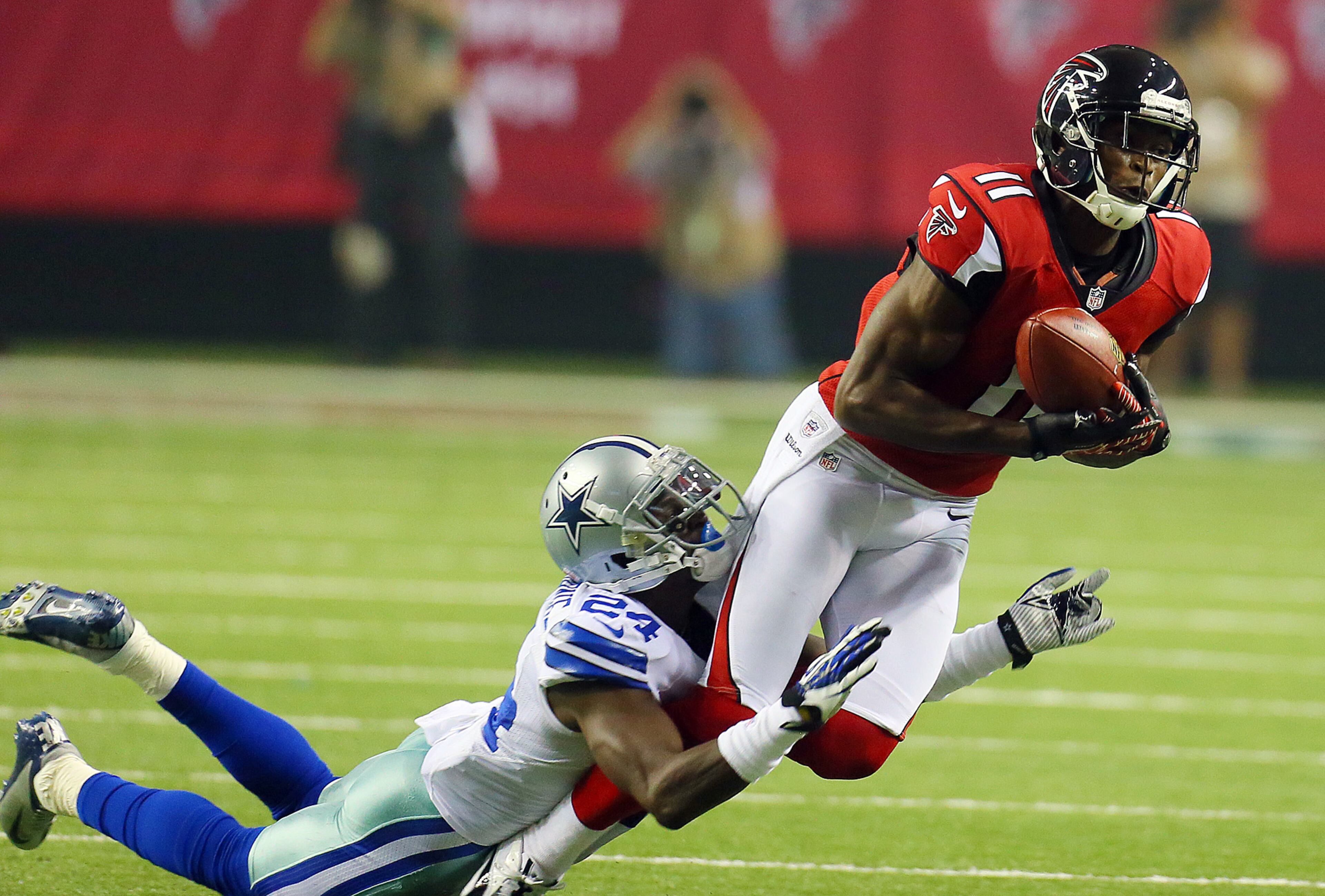 Atlanta Falcons wide reciever Julio Jones makes a long first down catch against Dallas Cowboys cornerback Morris Claiborne during 1st half action at the Georgia Dome in Atlanta on Sunday, Nov. 4, 2012. CURTIS COMPTON / CCOMPTON@AJC.COM