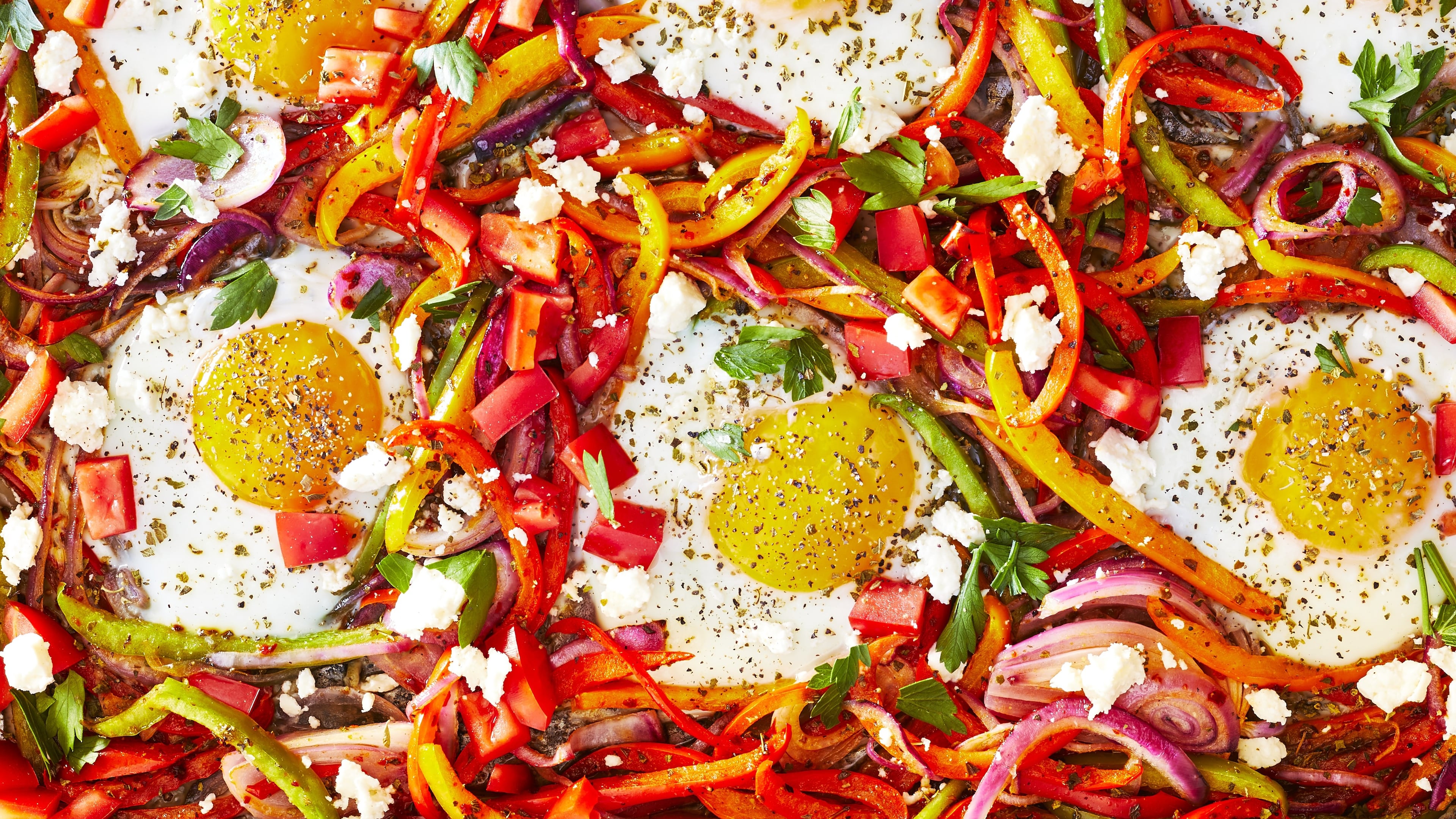 Baked sunny-side-up eggs with sweet peppers and onion recipe from "The Mediterranean Dish" cookbook by Suzy Karadsheh. (Caitlin Bensel/Courtesy of Clarkson Potter)