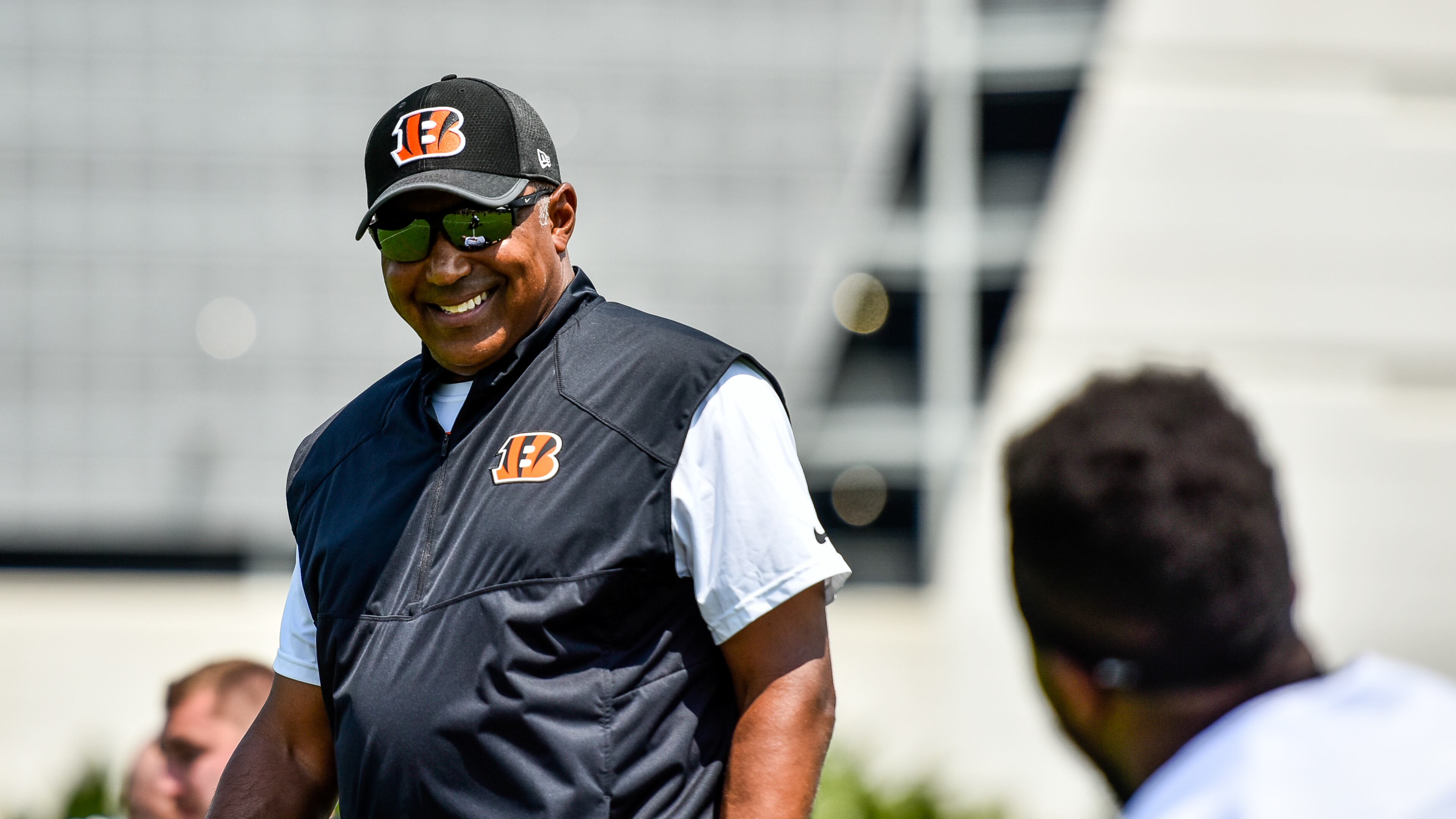 Head Coach Marvin Lewis smiles at a player during the first day of Cincinnati Bengals Training Camp Friday, July 28 at the practice fields beside Paul Brown Stadium in Cincinnati. NICK GRAHAM/STAFF